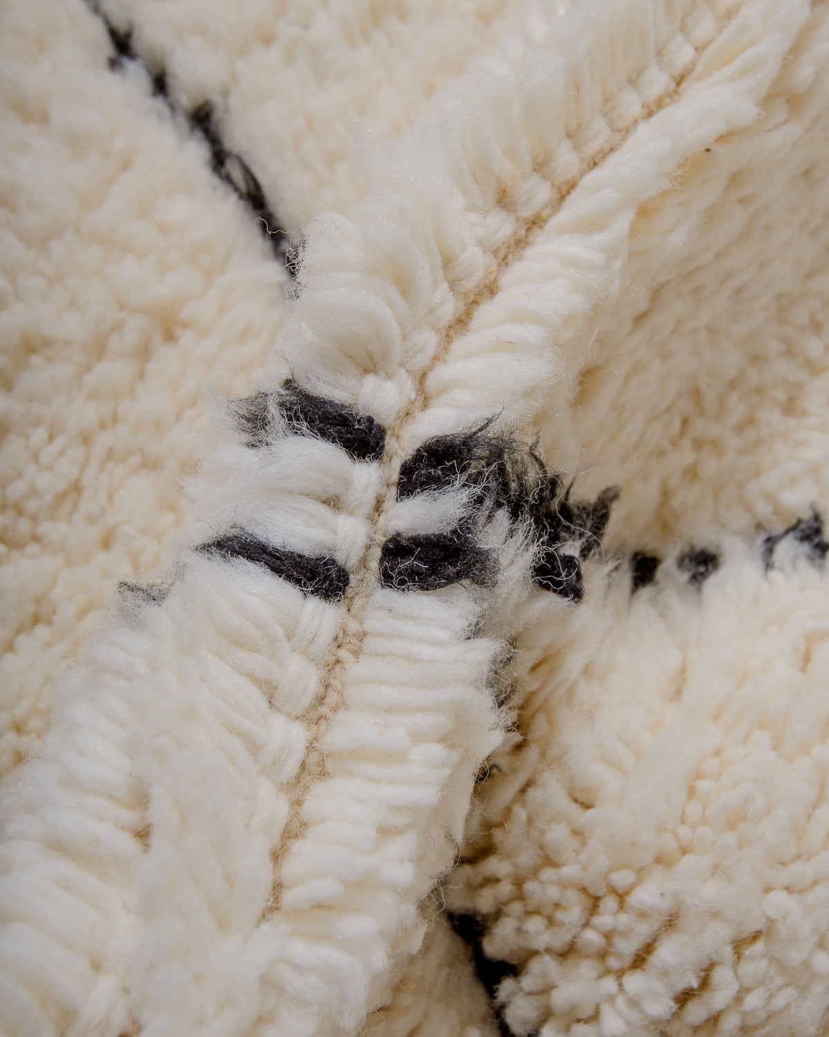 Modern, designer, handcrafted Berber rug from Morocco. Beniourain carpet with minimalist design, natural wool pile and a fluffy texture.