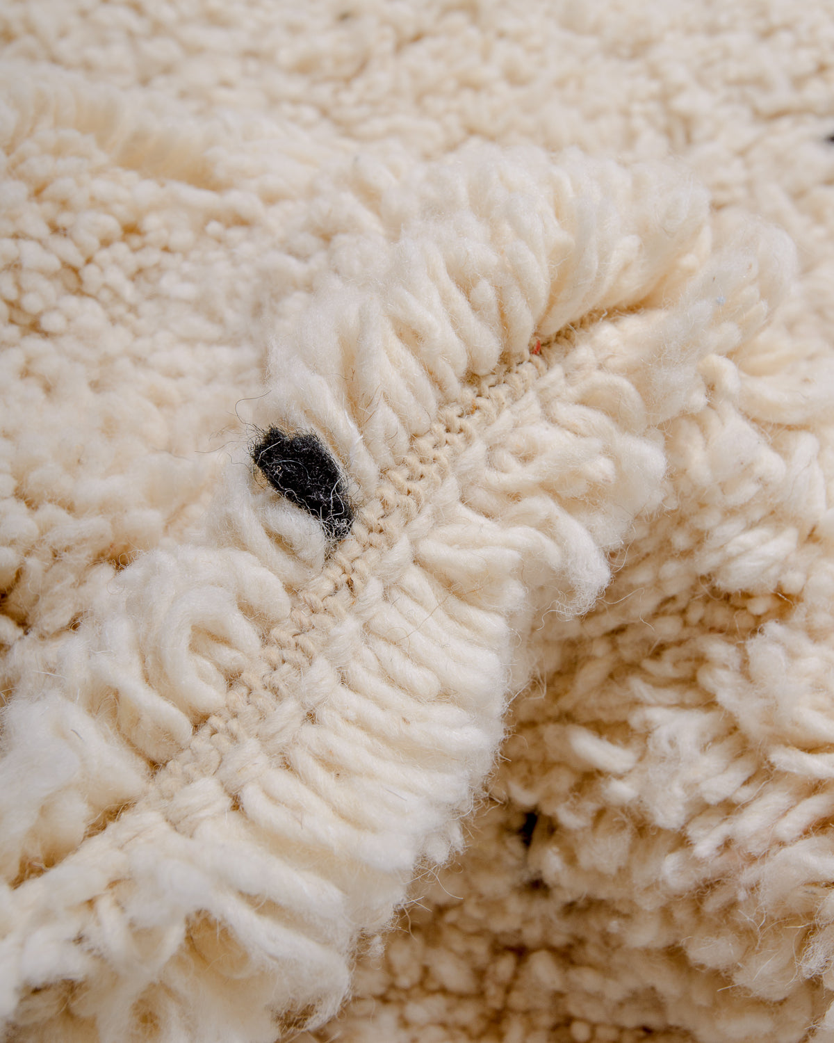 Modern, designer, handcrafted Berber rug from Morocco. Beniourain carpet with minimalist design, natural wool pile and a fluffy texture.