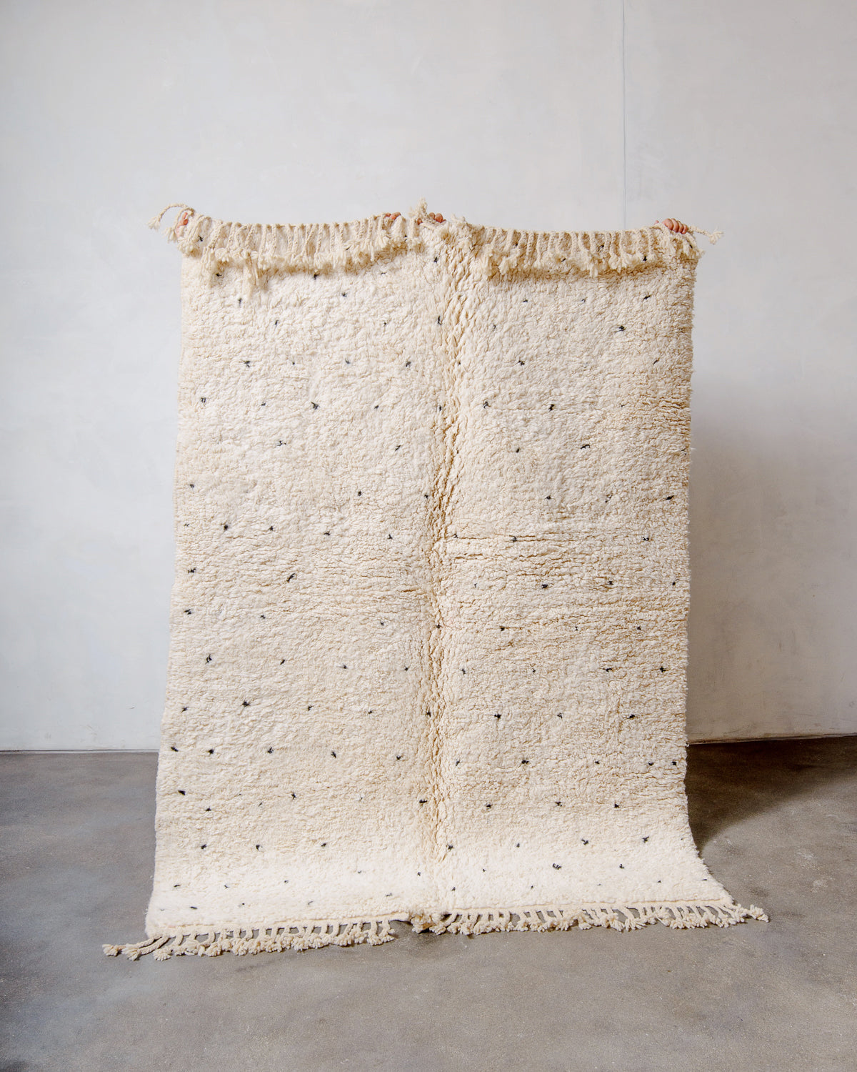 Modern, designer, handcrafted Berber rug from Morocco. Beniourain carpet with minimalist design, natural wool pile and a fluffy texture.