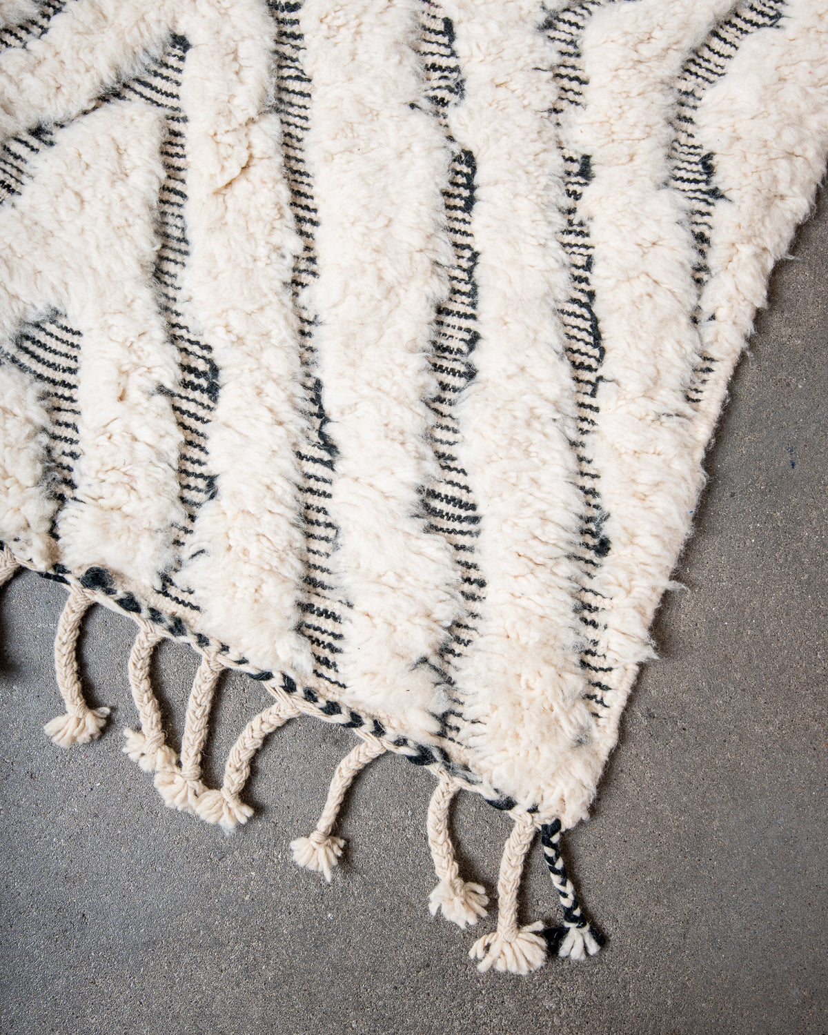 Modern, designer, handcrafted Berber rug from Morocco. Beniourain carpet with minimalist design, natural wool pile and a fluffy texture.
