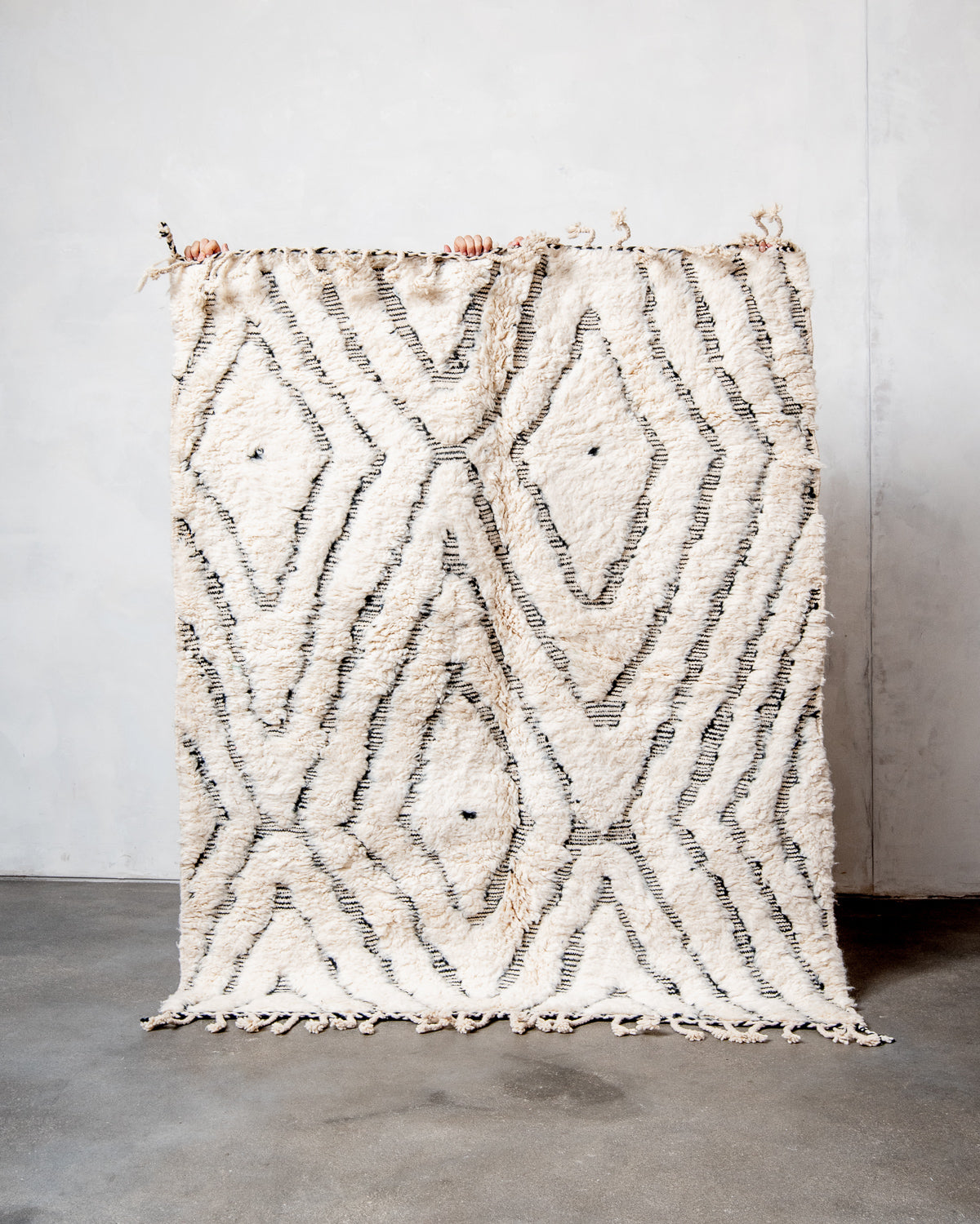 Modern, designer, handcrafted Berber rug from Morocco. Beniourain carpet with minimalist design, natural wool pile and a fluffy texture.