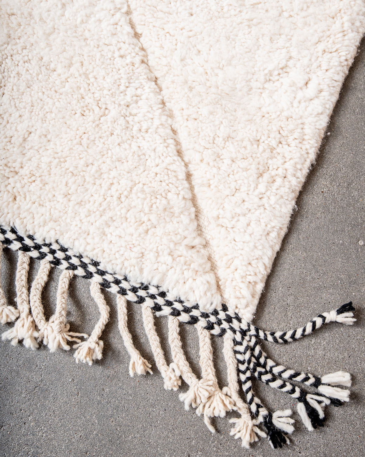 Modern, designer, handcrafted Berber rug from Morocco. Beniourain carpet with minimalist design, natural wool pile and a fluffy texture.