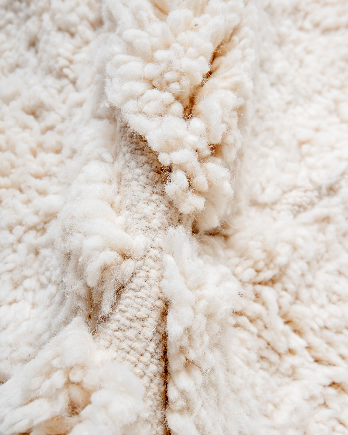 Modern, designer, handcrafted Berber rug from Morocco. Beniourain carpet with minimalist design, natural wool pile and a fluffy texture.