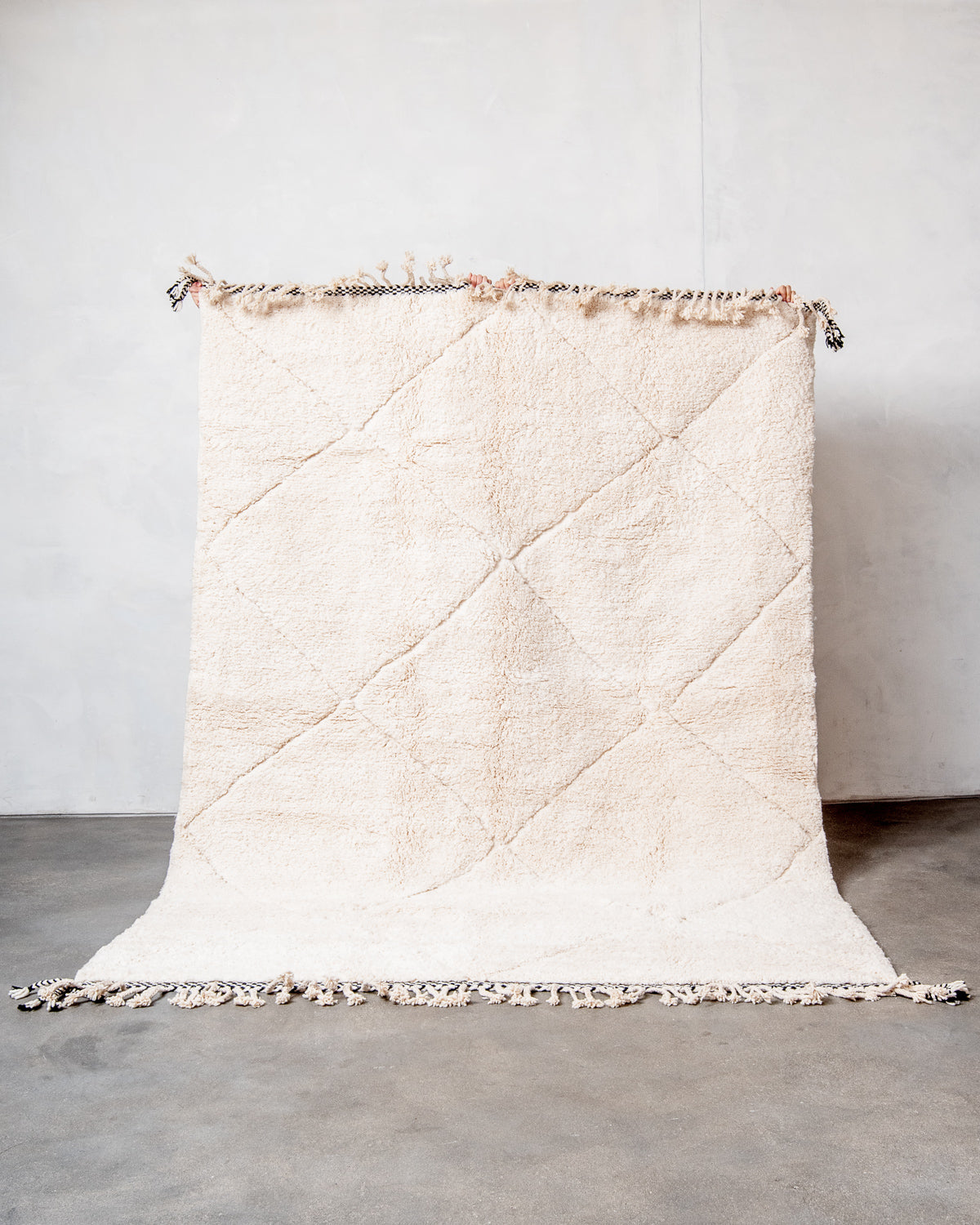 Modern, designer, handcrafted Berber rug from Morocco. Beniourain carpet with minimalist design, natural wool pile and a fluffy texture.