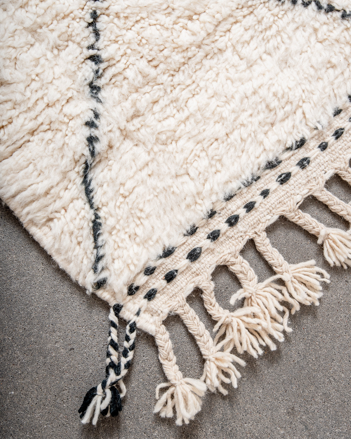 Modern, designer, handcrafted Berber rug from Morocco. Beniourain carpet with minimalist design, natural wool pile and a fluffy texture.