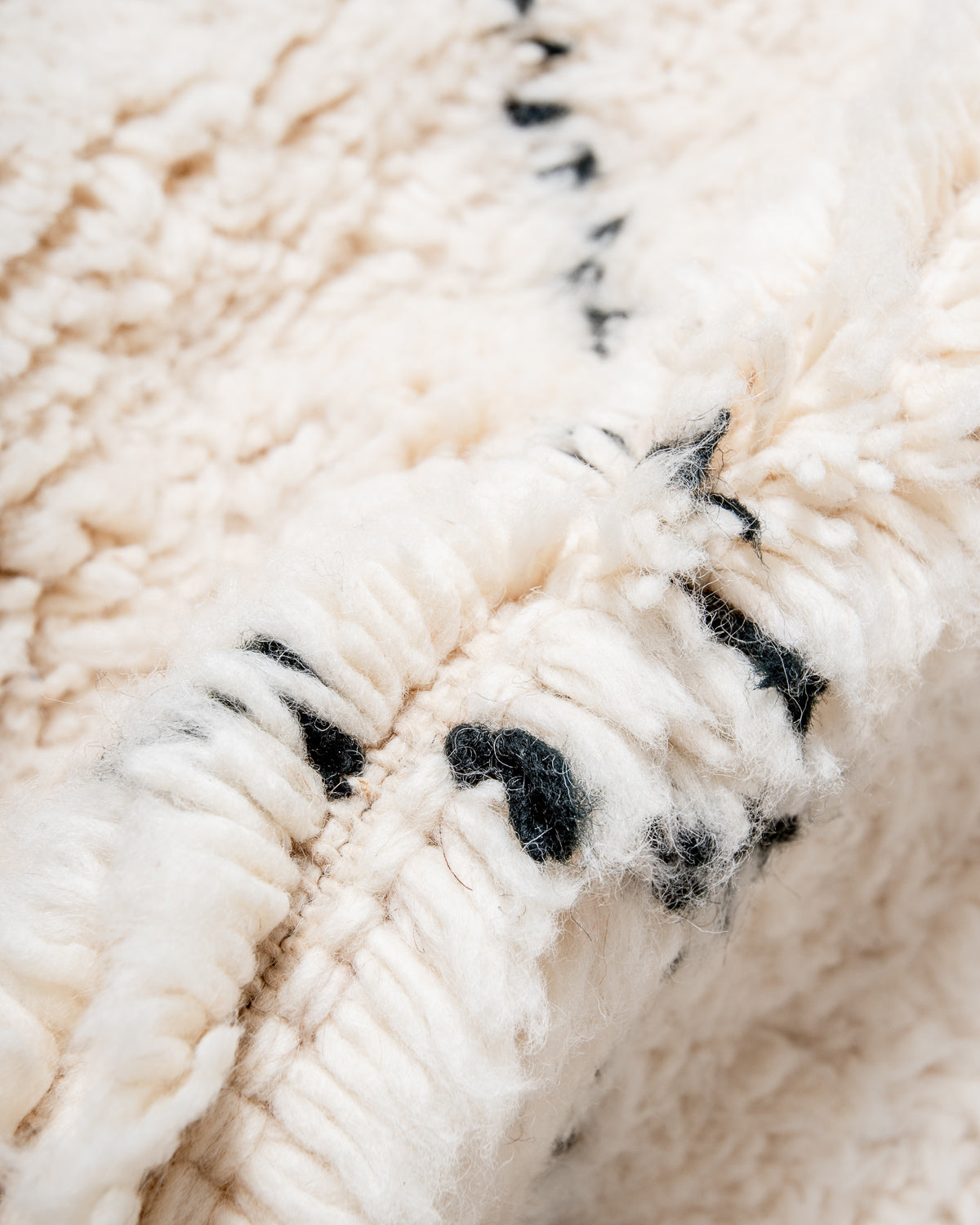 Modern, designer, handcrafted Berber rug from Morocco. Beniourain carpet with minimalist design, natural wool pile and a fluffy texture.