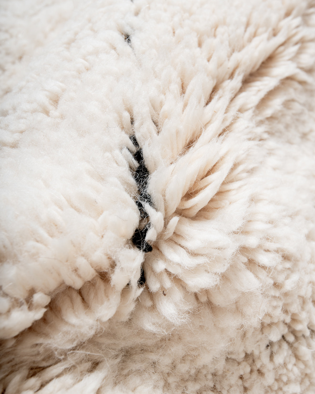 Modern, designer, handcrafted Berber rug from Morocco. Beniourain carpet with minimalist design, natural wool pile and a fluffy texture.