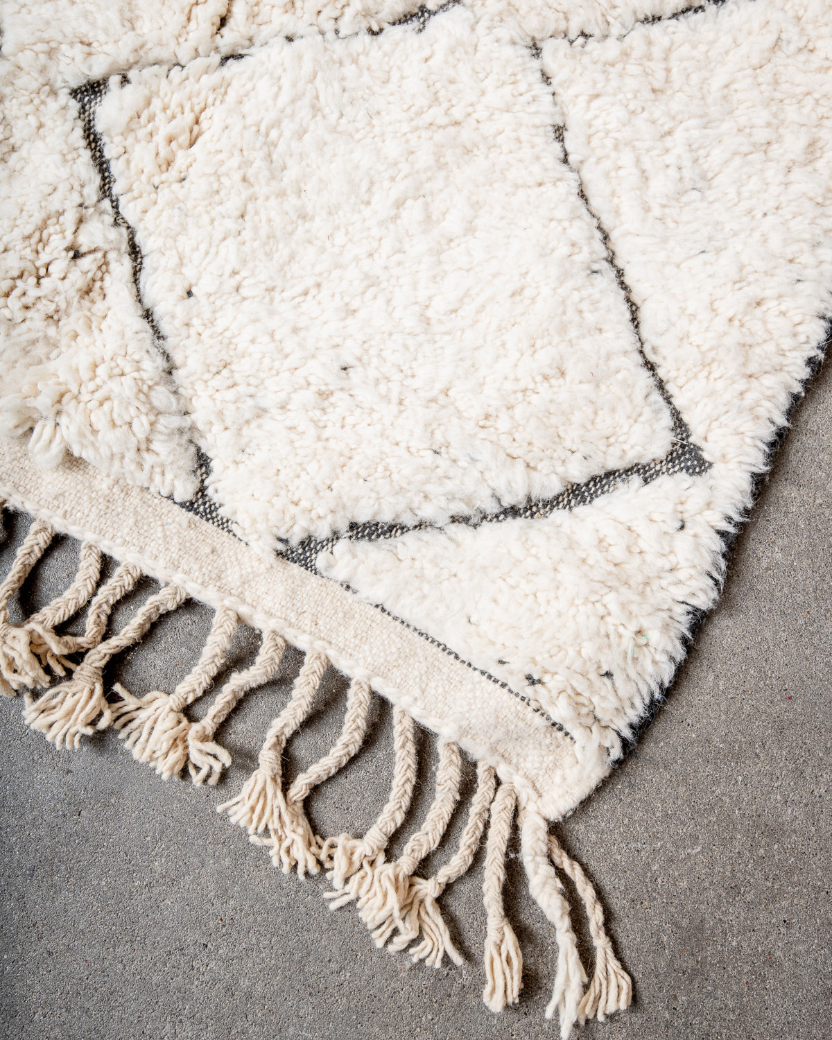 Modern, designer, handcrafted Berber rug from Morocco. Beniourain carpet with minimalist design, natural wool pile and a fluffy texture.