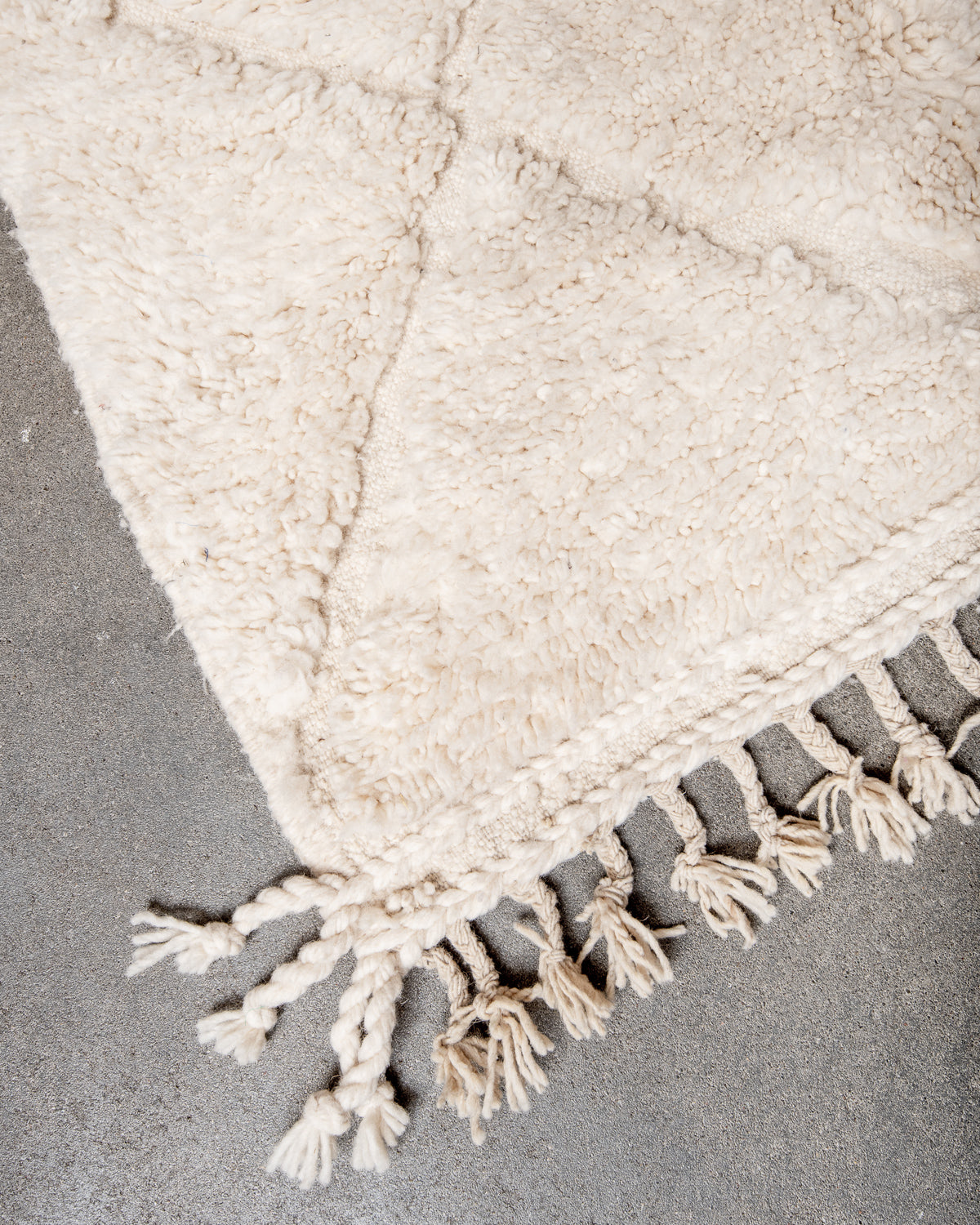 Modern, designer, handcrafted Berber rug from Morocco. Beniourain carpet with minimalist design, natural wool pile and a fluffy texture.