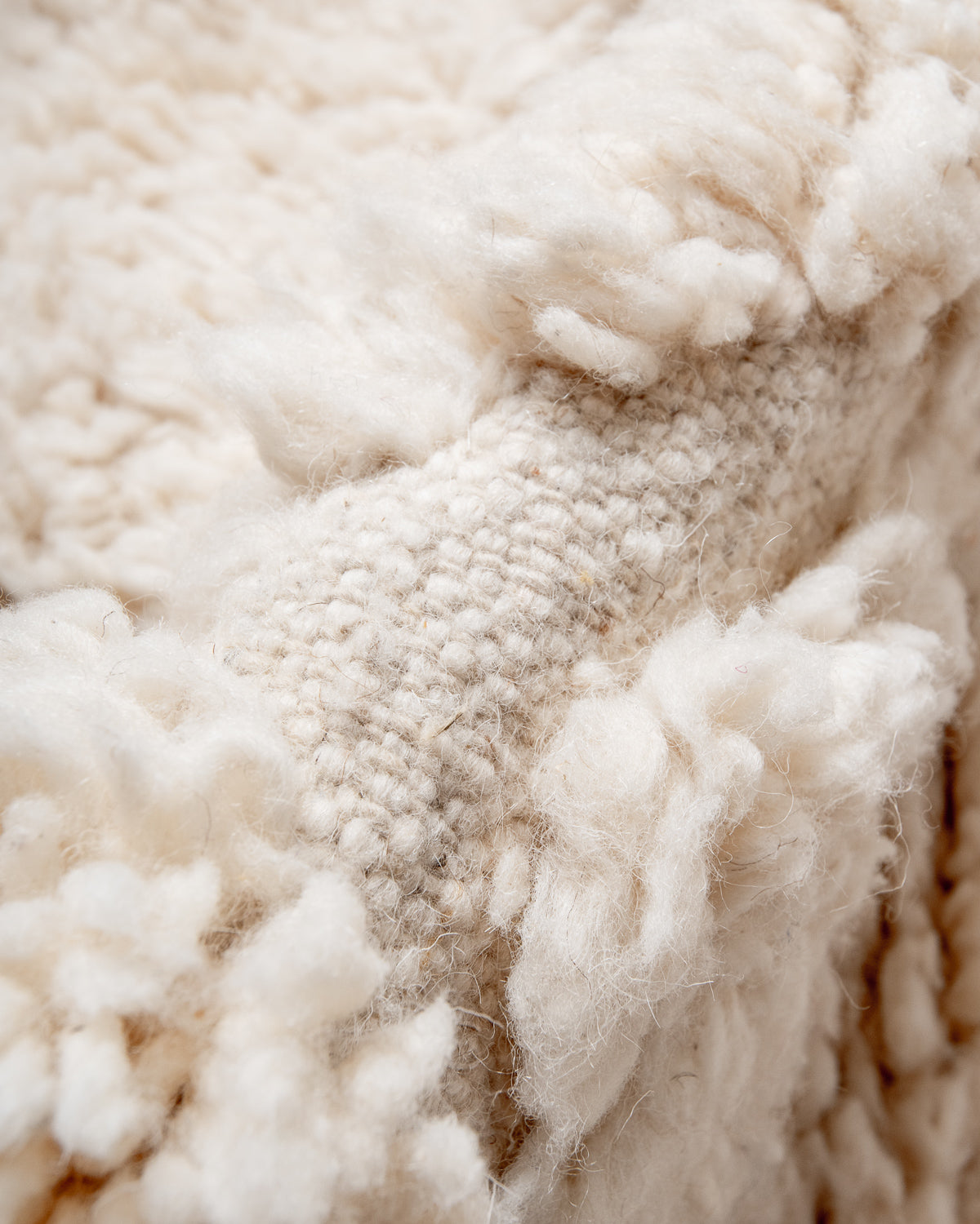 Modern, designer, handcrafted Berber rug from Morocco. Beniourain carpet with minimalist design, natural wool pile and a fluffy texture.