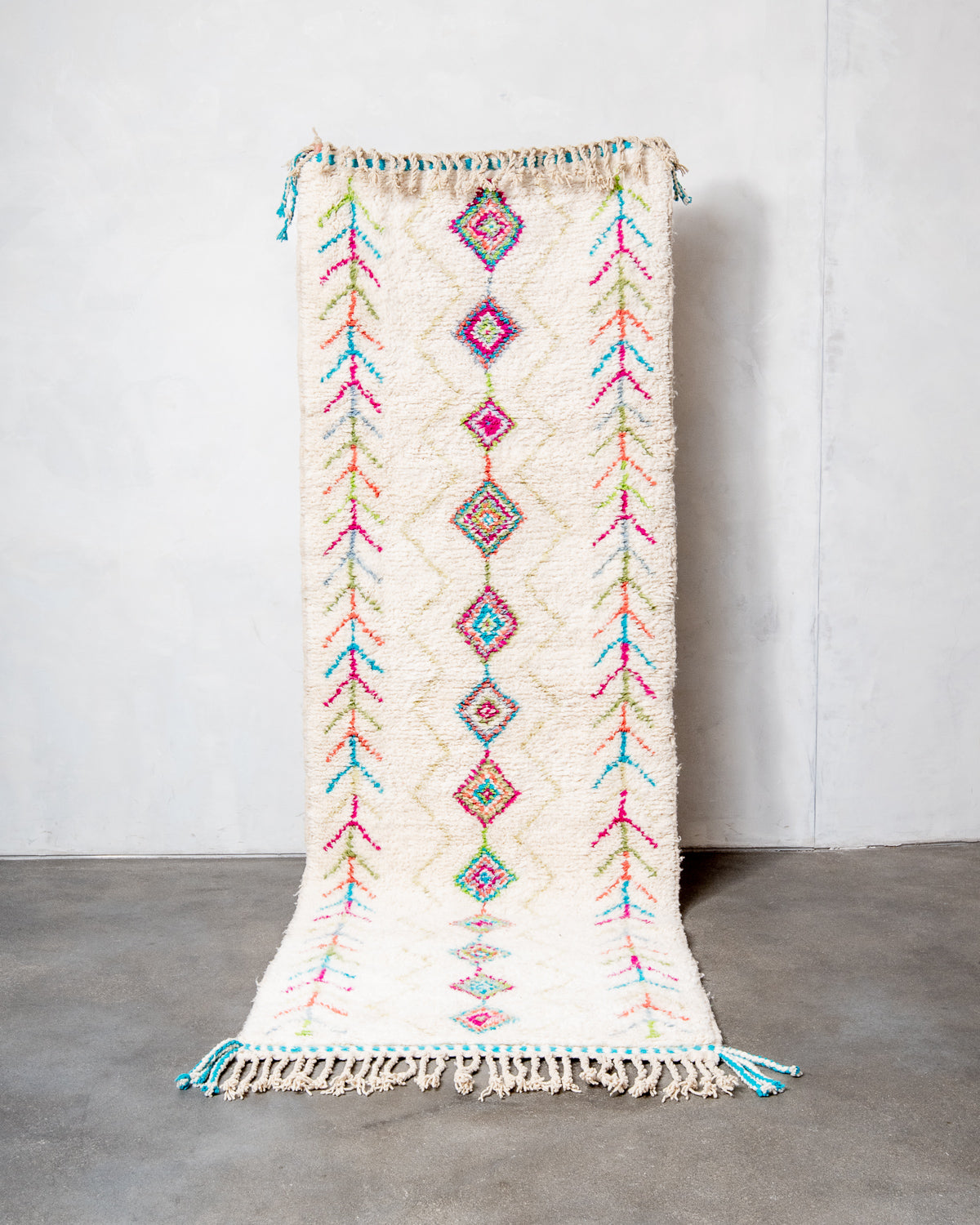 Modern, designer, handcrafted Berber runner rug from Morocco. Beniourain carpet with beautiful colours and patterns and fluffy wool texture.