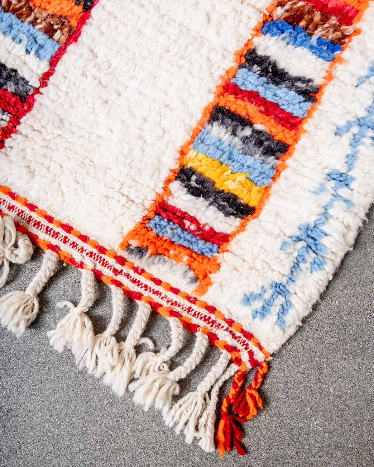 Modern, designer, handcrafted Berber rug from Morocco. Beniourain carpet with beautiful colours and patterns and fluffy wool texture.