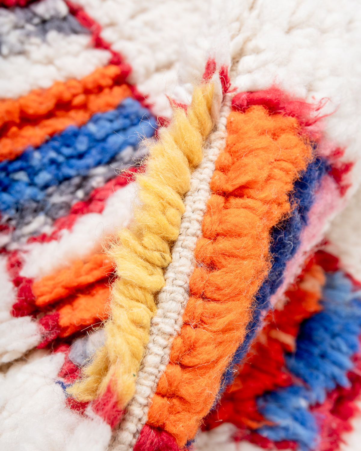 Modern, designer, handcrafted Berber rug from Morocco. Beniourain carpet with beautiful colours and patterns and fluffy wool texture.