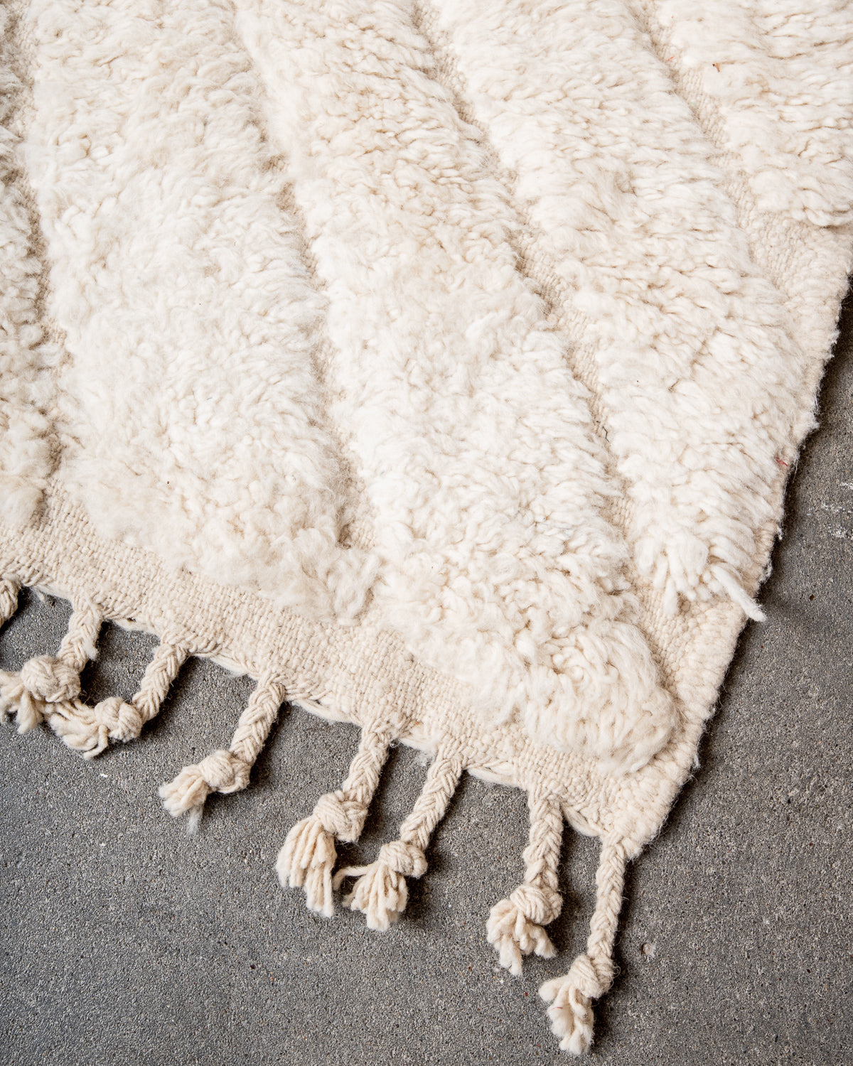 Modern, designer, handcrafted Berber rug from Morocco. Beniourain carpet with minimalist design, natural wool pile and a fluffy texture.