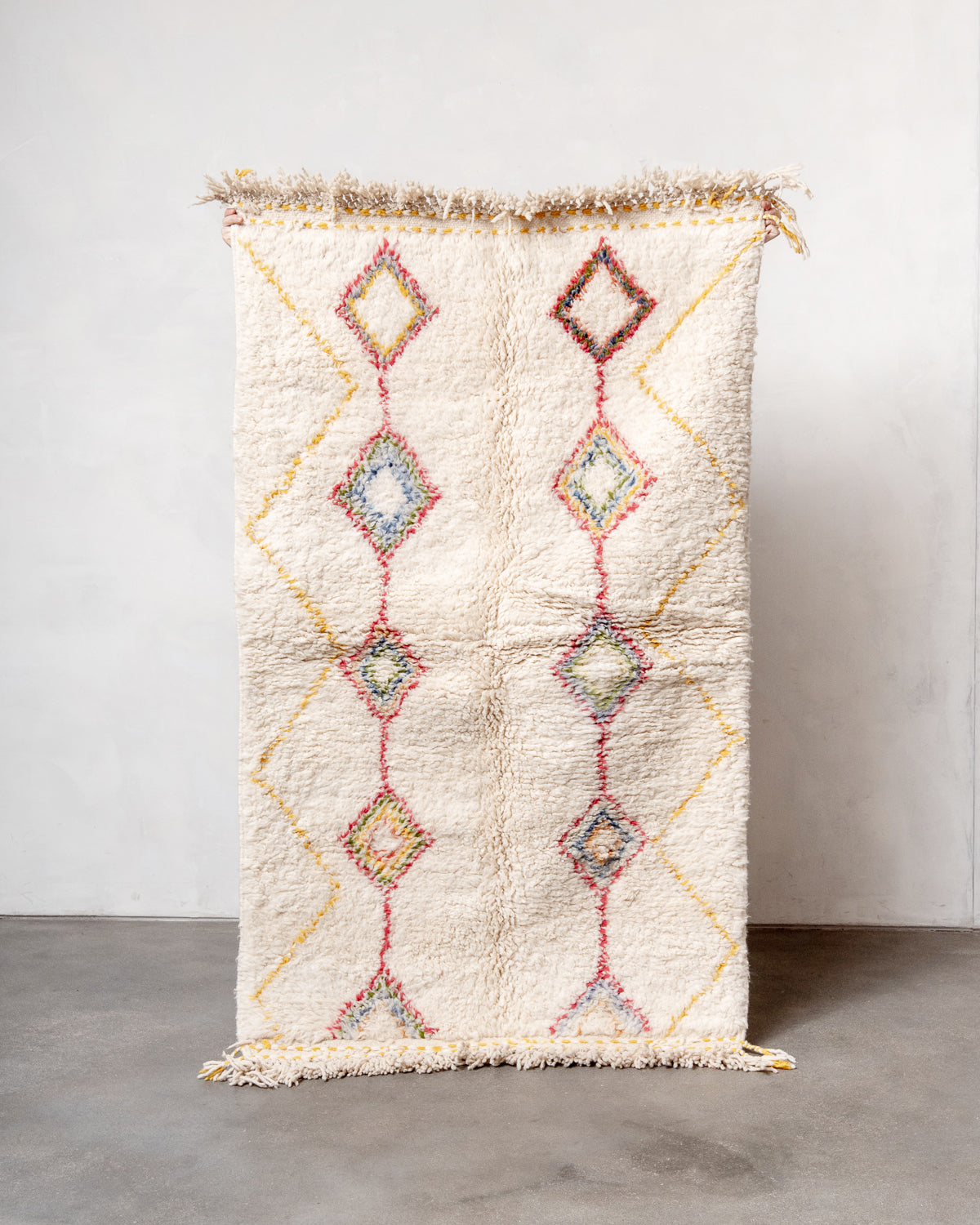 Modern, designer, handcrafted Berber rug from Morocco. Beniourain carpet with beautiful colours and patterns and fluffy wool texture.