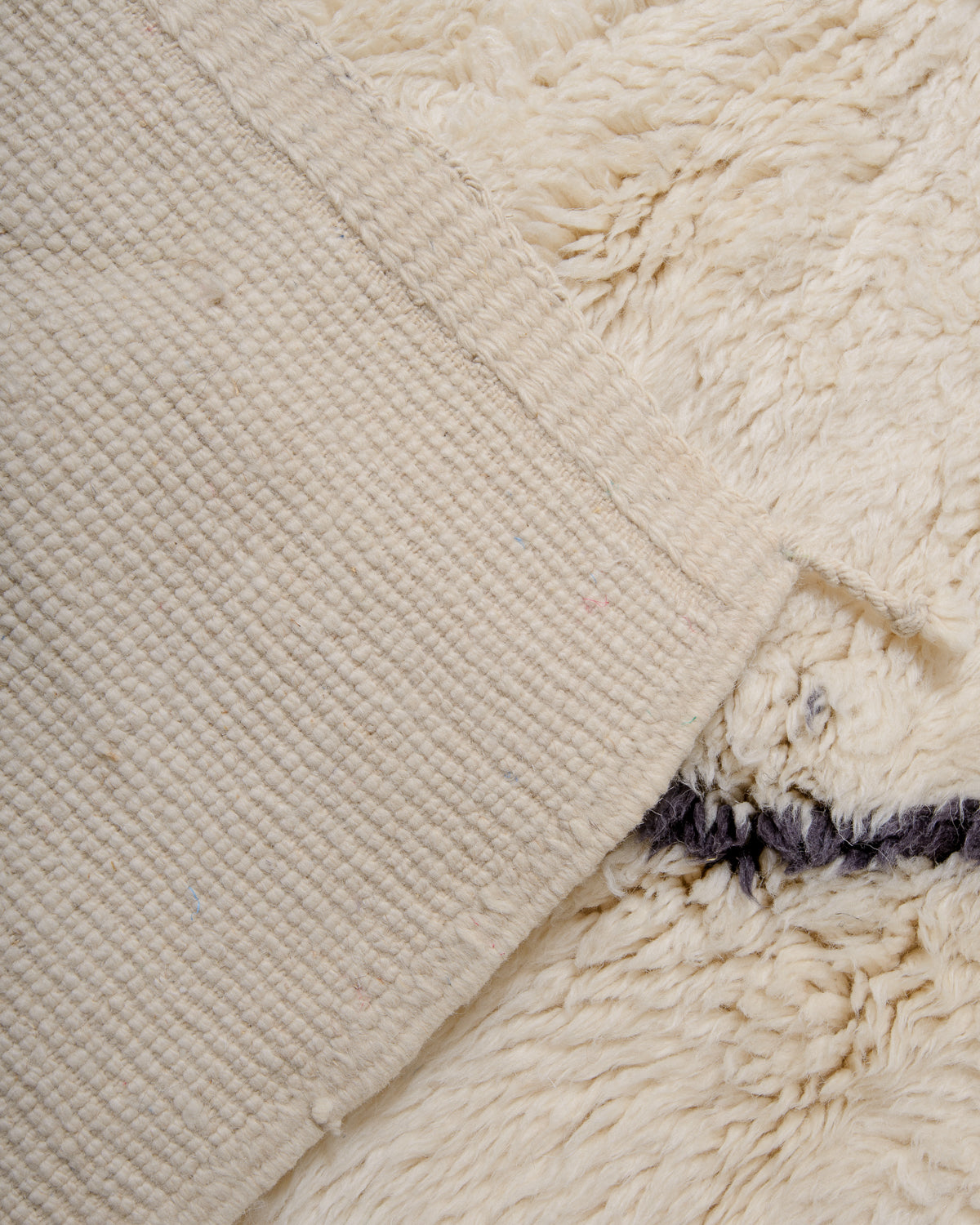 Modern, designer, handcrafted 100% sheep’s wool Berber rug from Morocco. Beni M’rirt carpet with beautiful colours and patterns and fluffy wool texture.