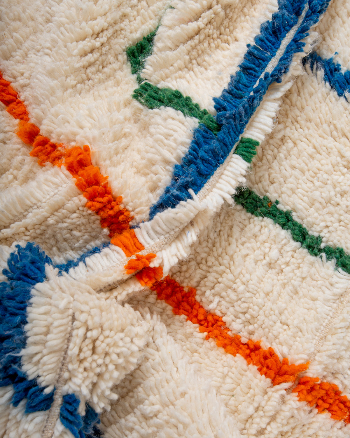 Modern, designer, handcrafted Berber rug from Morocco. Beniourain carpet with beautiful colours and patterns and fluffy wool texture.