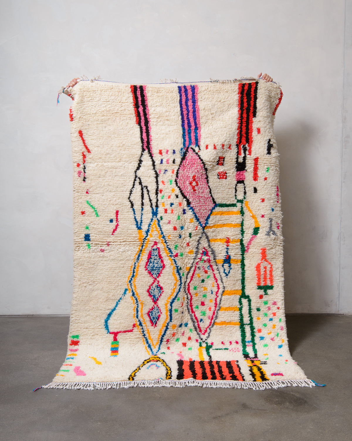 Modern designer handcrafted Berber rug from Morocco. Azilal rug with beautiful colours and patterns. Made of sheep’s wool and colourful cotton.Modern designer handcrafted Berber rug from Morocco. Azilal rug with beautiful colours and patterns. Made of sheep’s wool and colourful cotton.