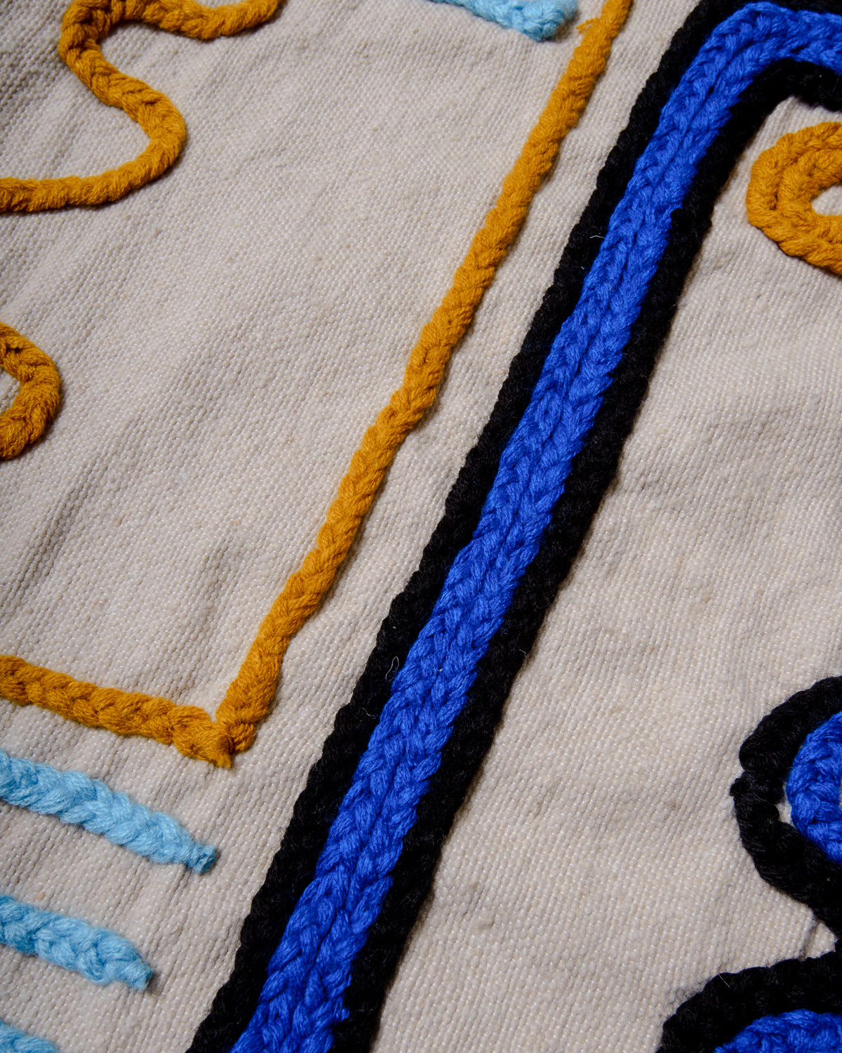 Handcrafted cushion cover from Morocco. Soft Wool cushion with modern, embroidered design.