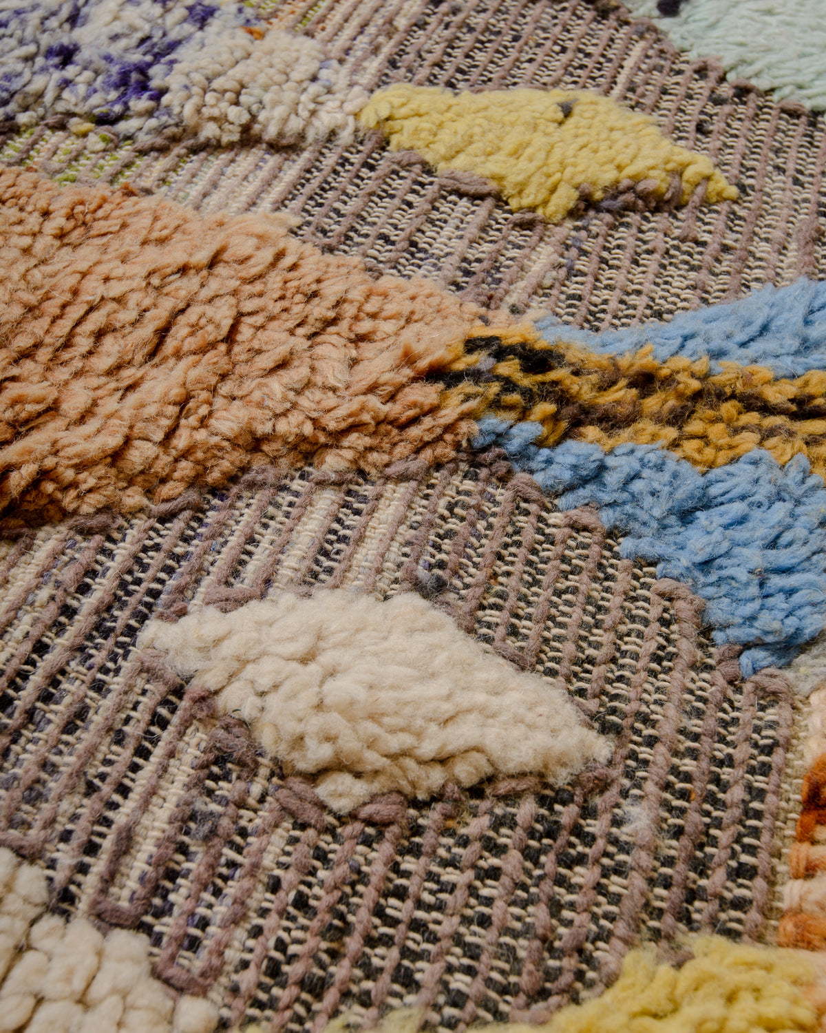 Modern, designer, handcrafted Berber rug from Morocco. Beniourain carpet with beautiful colours and patterns and fluffy wool texture.