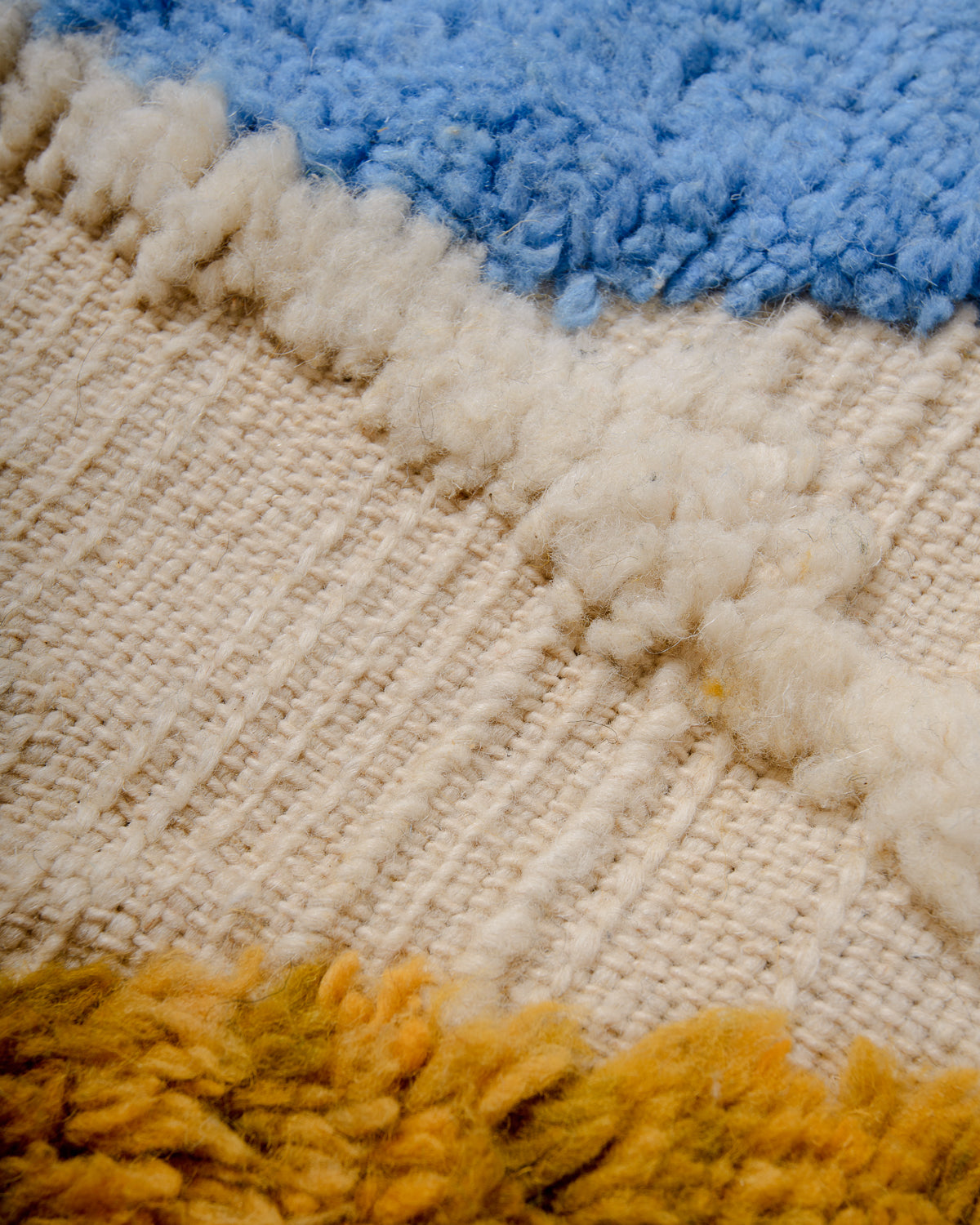 Modern, designer, handcrafted Berber rug from Morocco. Beniourain carpet with beautiful colours and patterns and fluffy wool texture.