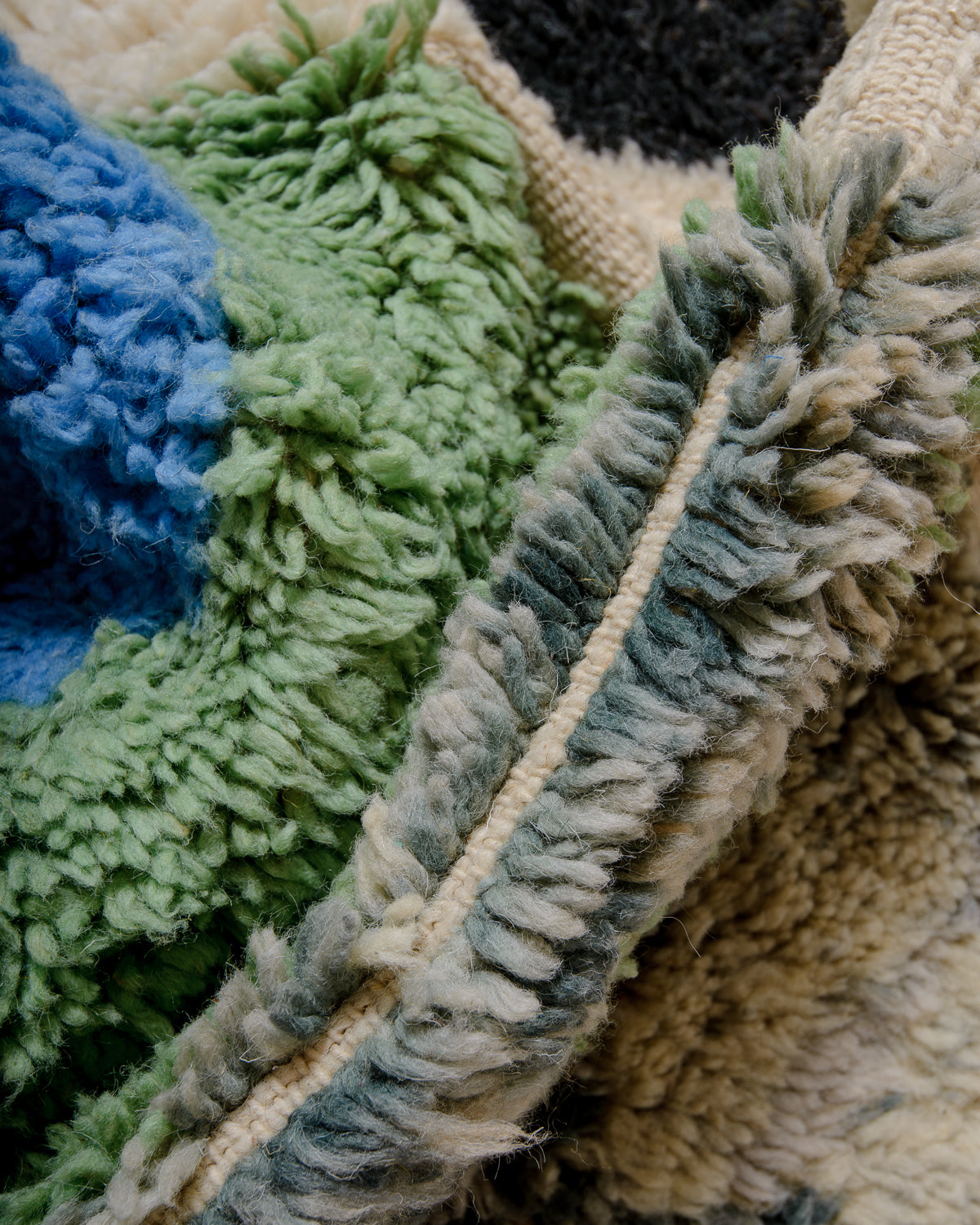 Modern, designer, handcrafted Berber rug from Morocco. Beniourain carpet with beautiful colours and patterns and fluffy wool texture.