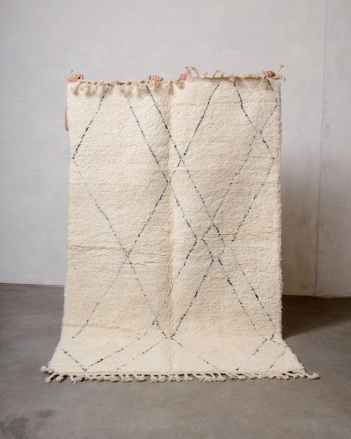 Modern, designer, handcrafted Berber rug from Morocco. Beniourain carpet with minimalist design, natural wool pile and a fluffy texture.