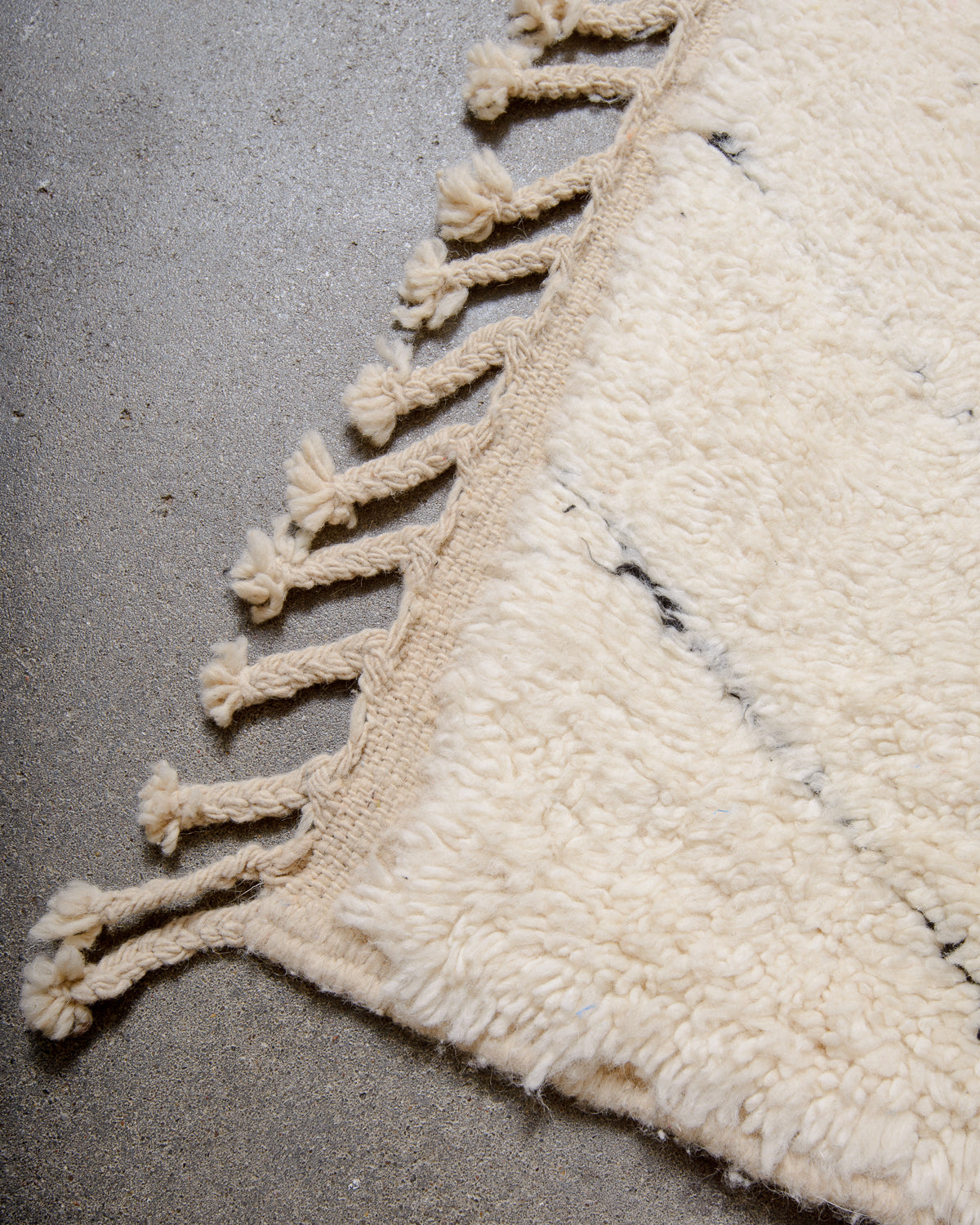 Modern, designer, handcrafted Berber rug from Morocco. Beniourain carpet with minimalist design, natural wool pile and a fluffy texture.