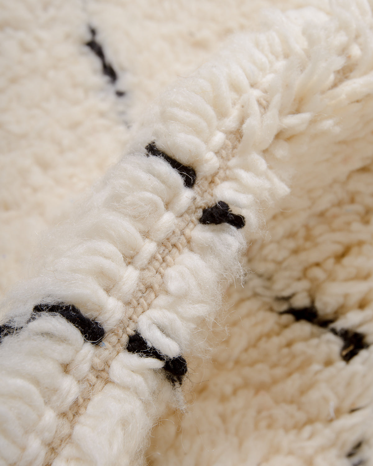 Modern, designer, handcrafted Berber rug from Morocco. Beniourain carpet with minimalist design, natural wool pile and a fluffy texture.