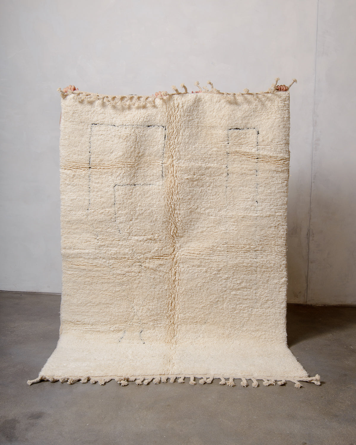 Modern, designer, handcrafted Berber rug from Morocco. Beniourain carpet with minimalist design, natural wool pile and a fluffy texture.
