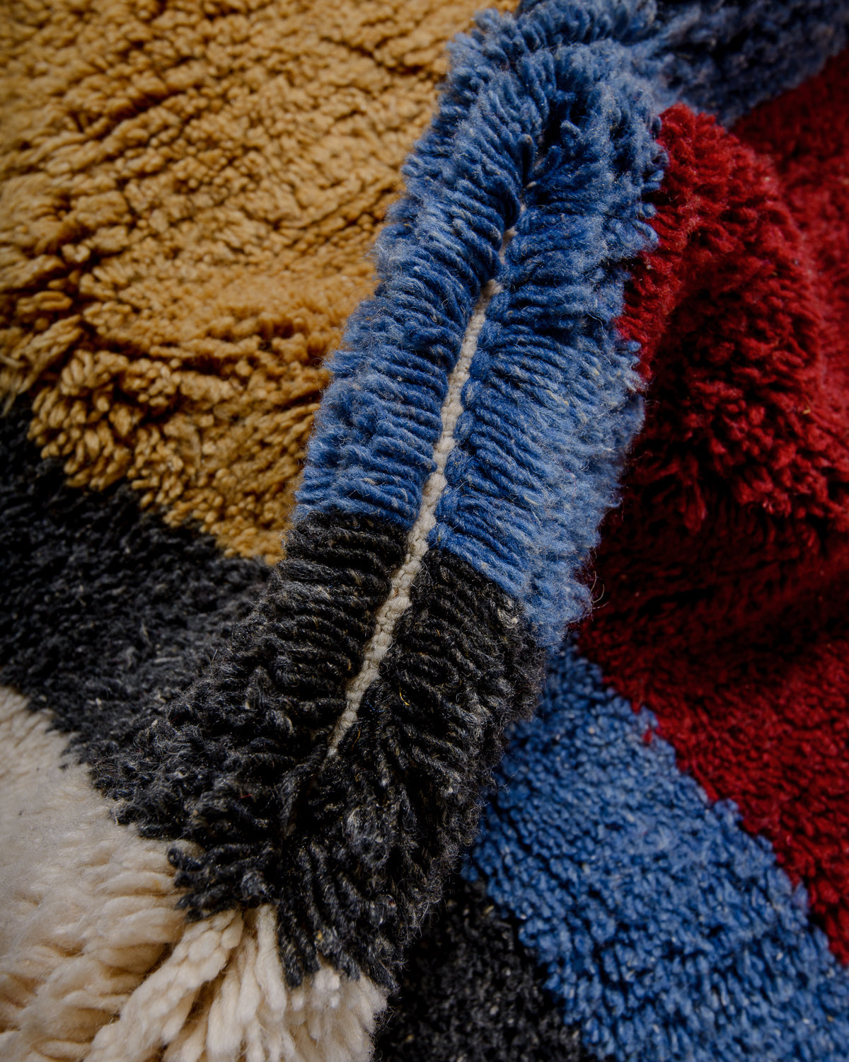 Modern, designer, handcrafted Berber rug from Morocco. Beniourain carpet with beautiful colours and patterns and fluffy wool texture.