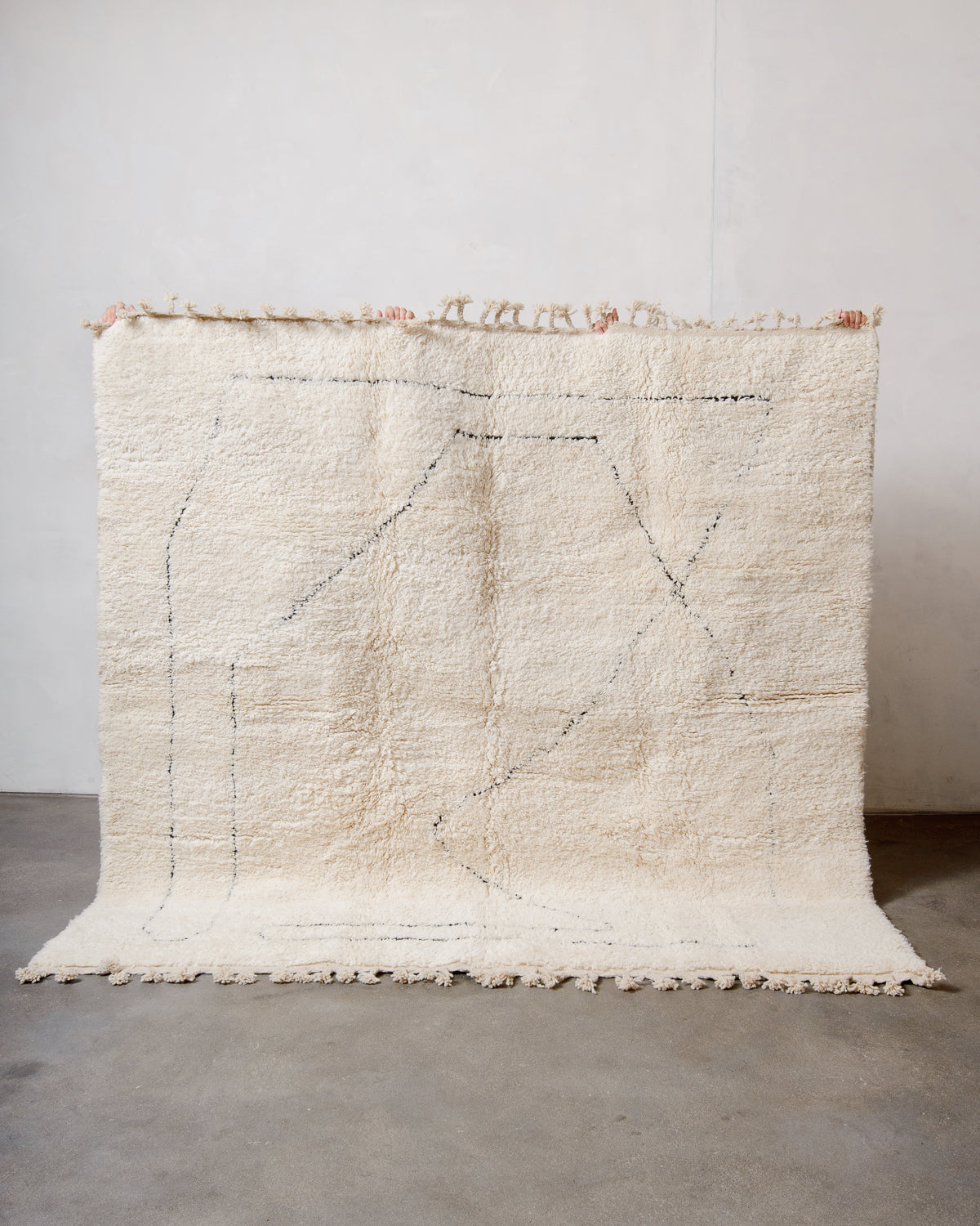 Modern, designer, handcrafted Berber rug from Morocco. Beniourain carpet with minimalist design, natural wool pile and a fluffy texture.