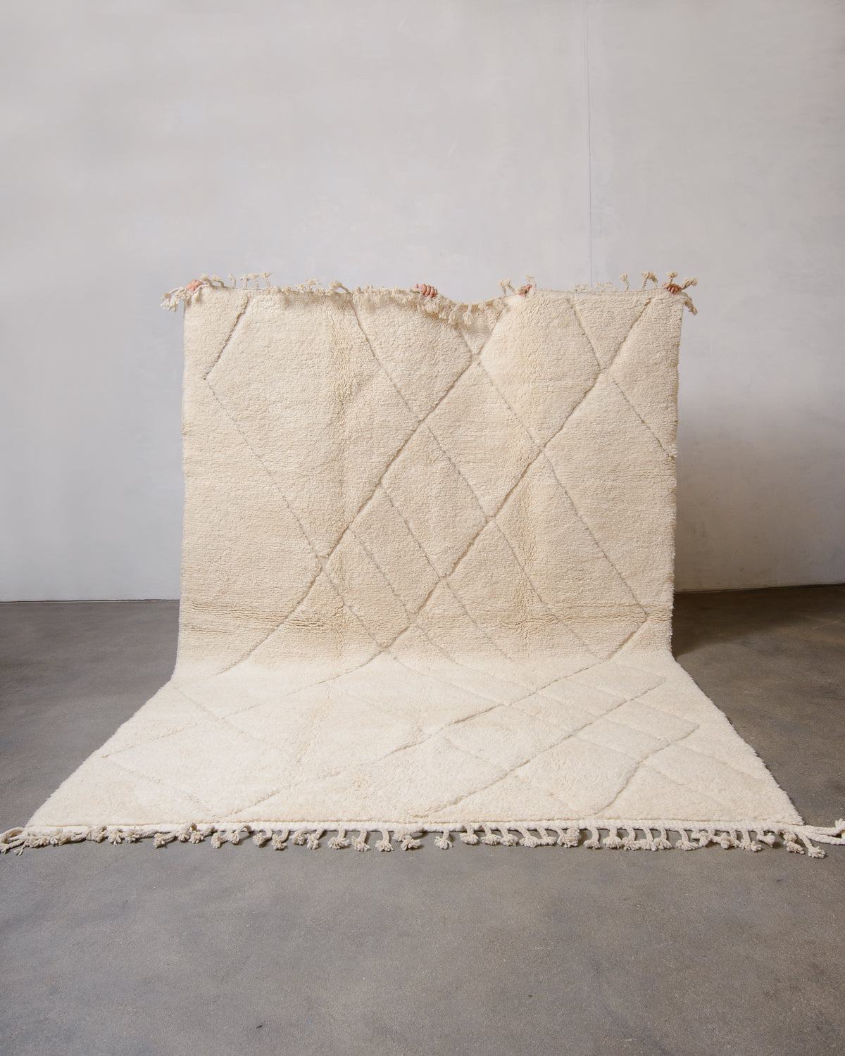 Modern, designer, handcrafted Berber rug from Morocco. Beniourain carpet with minimalist design, natural wool pile and a fluffy texture.