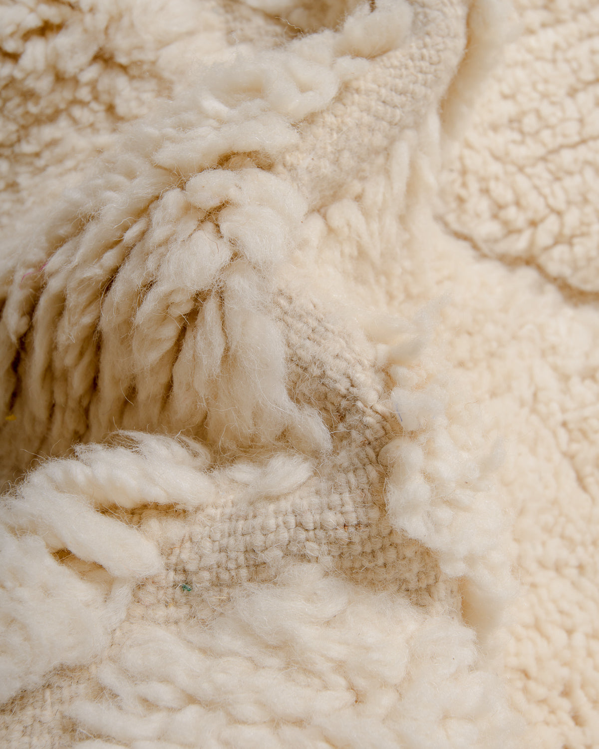 Modern, designer, handcrafted Berber rug from Morocco. Beniourain carpet with minimalist design, natural wool pile and a fluffy texture.