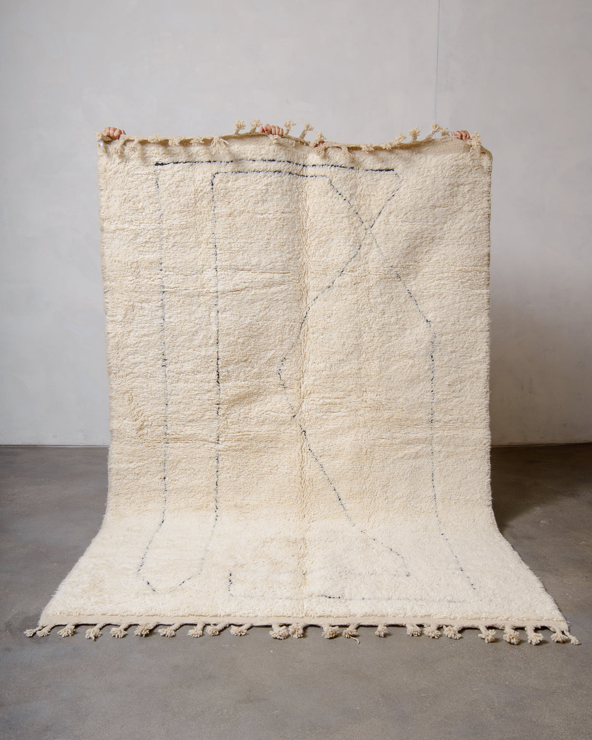 Modern, designer, handcrafted Berber rug from Morocco. Beniourain carpet with minimalist design, natural wool pile and a fluffy texture.