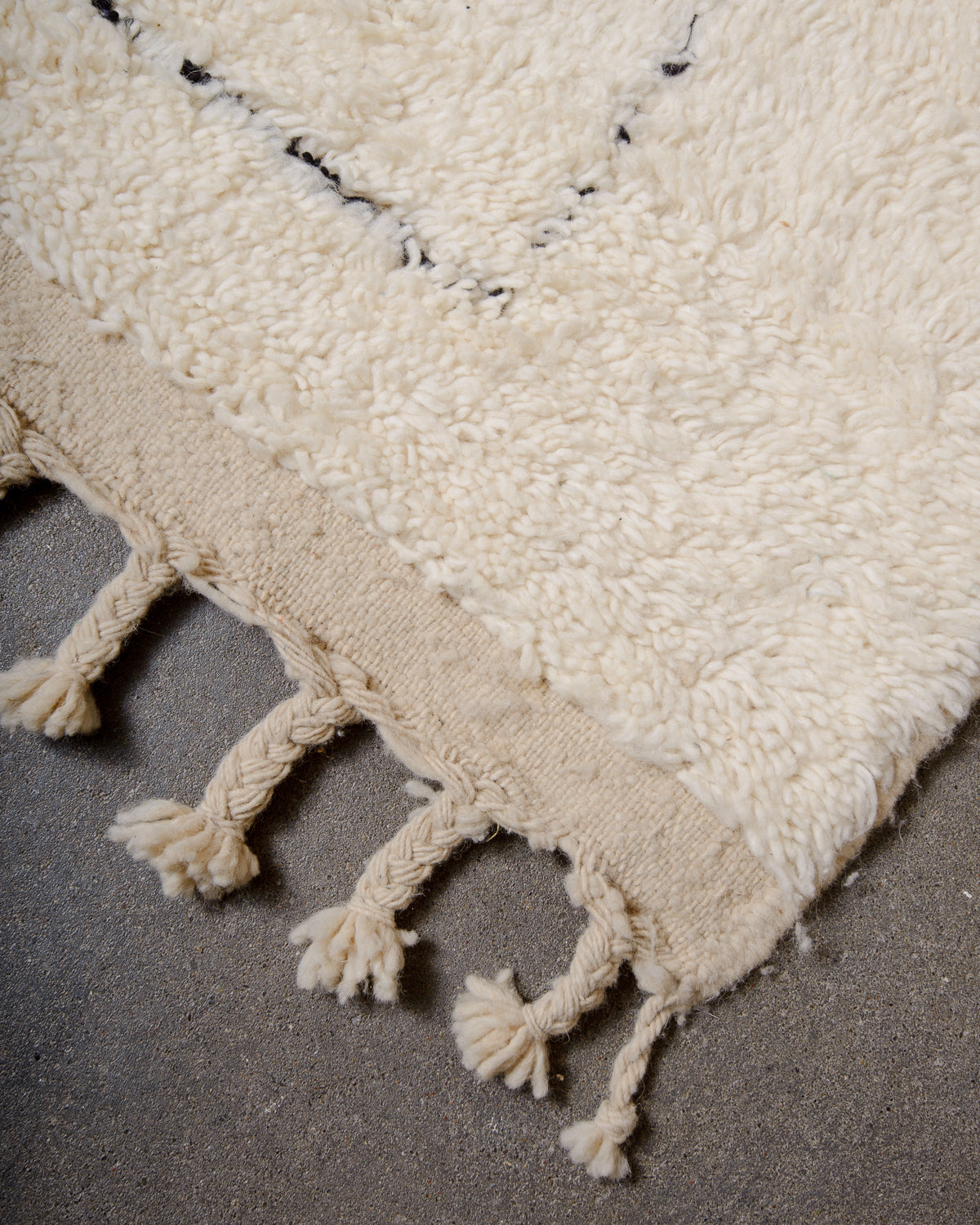 Modern, designer, handcrafted Berber rug from Morocco. Beniourain carpet with minimalist design, natural wool pile and a fluffy texture.