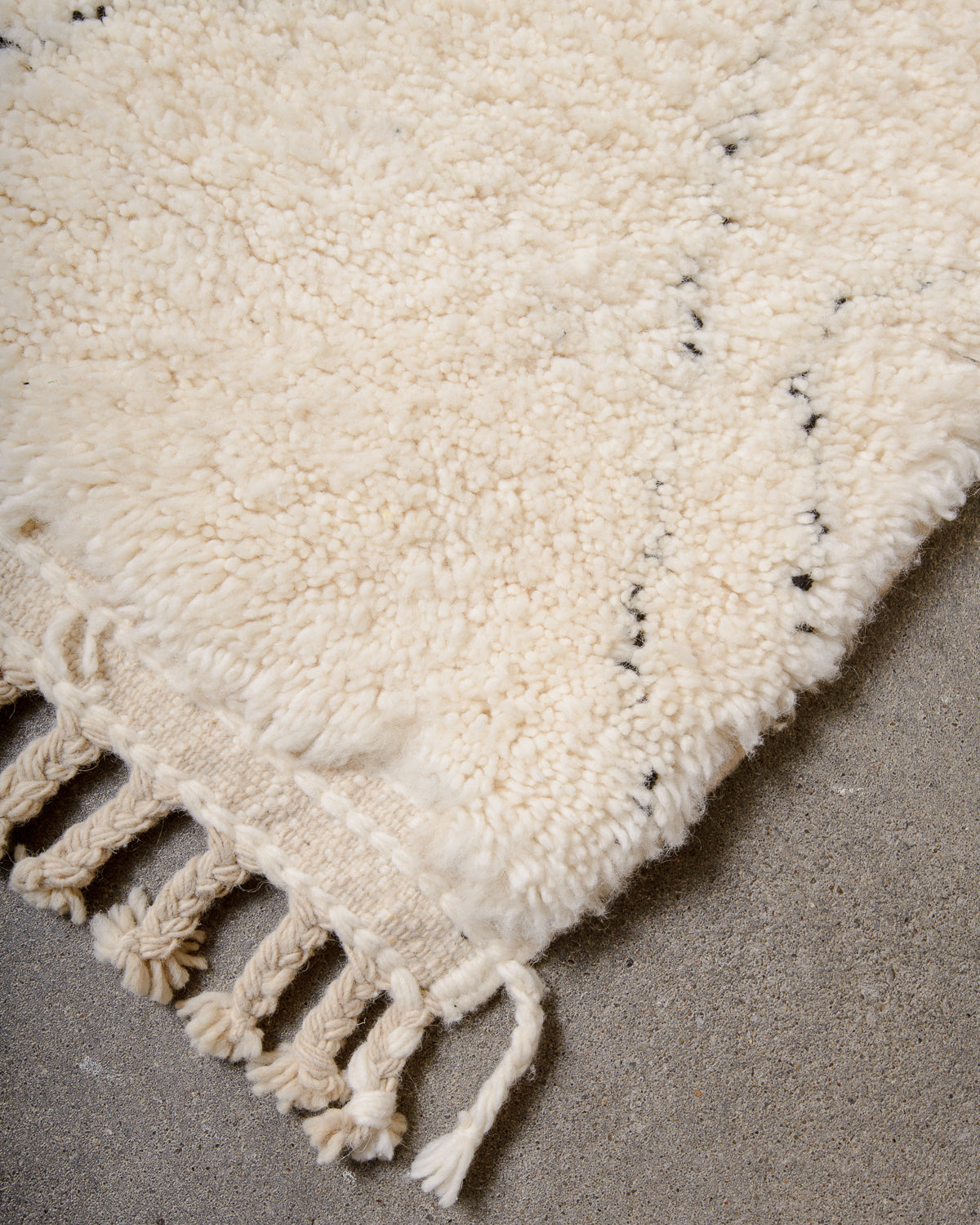 Modern, designer, handcrafted Berber rug from Morocco. Beniourain carpet with minimalist design, natural wool pile and a fluffy texture.