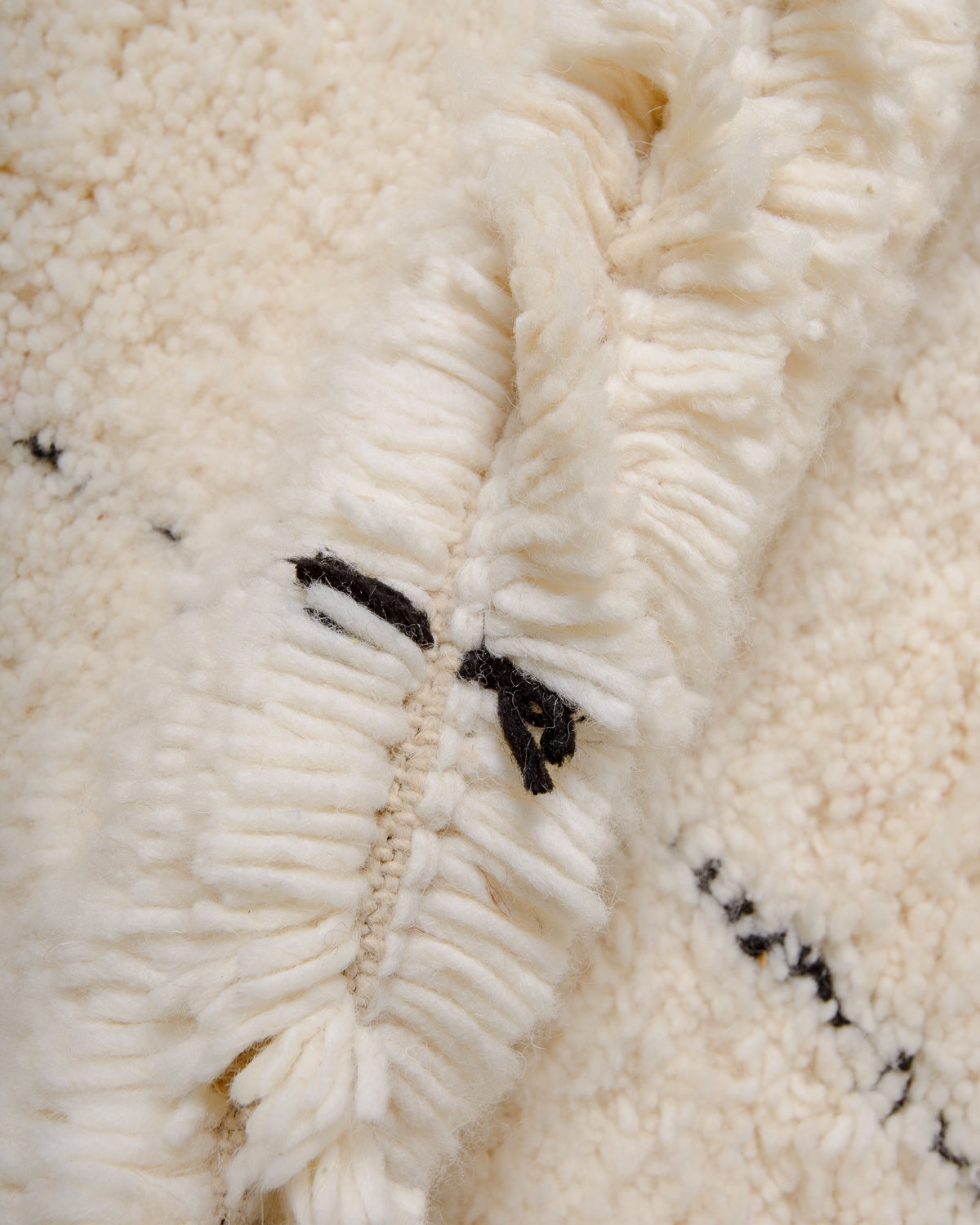 Modern, designer, handcrafted Berber rug from Morocco. Beniourain carpet with minimalist design, natural wool pile and a fluffy texture.