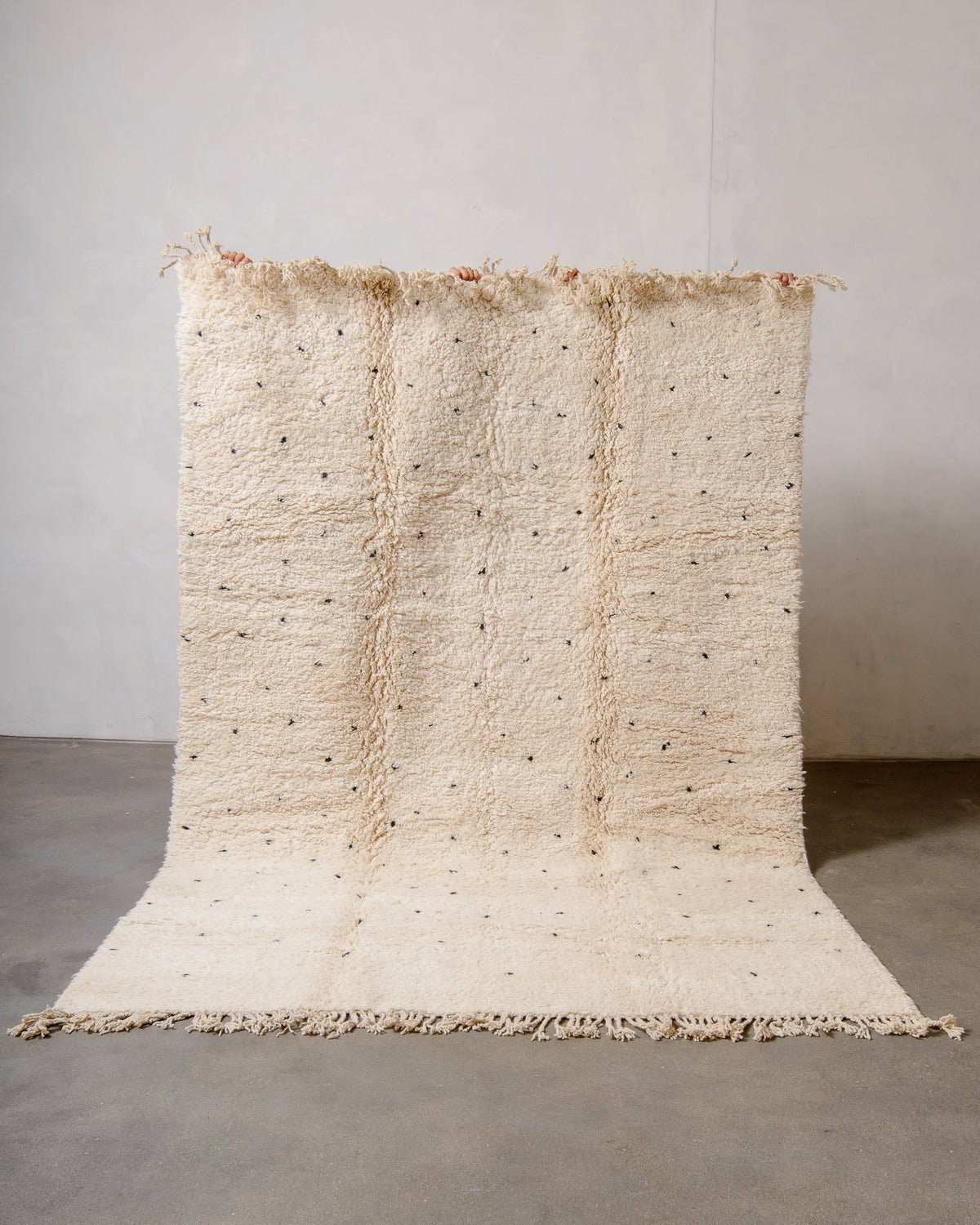 Modern, designer, handcrafted Berber rug from Morocco. Beniourain carpet with minimalist design, natural wool pile and a fluffy texture.