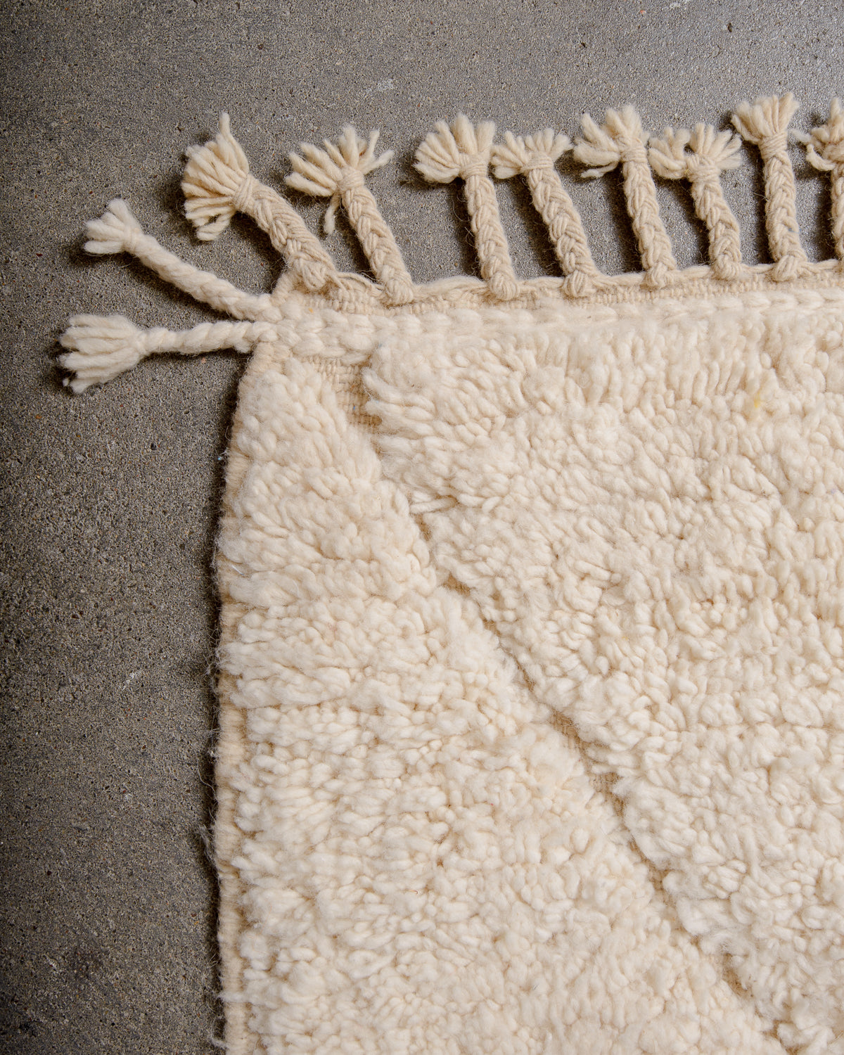 Modern, designer, handcrafted Berber rug from Morocco. Beniourain carpet with minimalist design, natural wool pile and a fluffy texture.