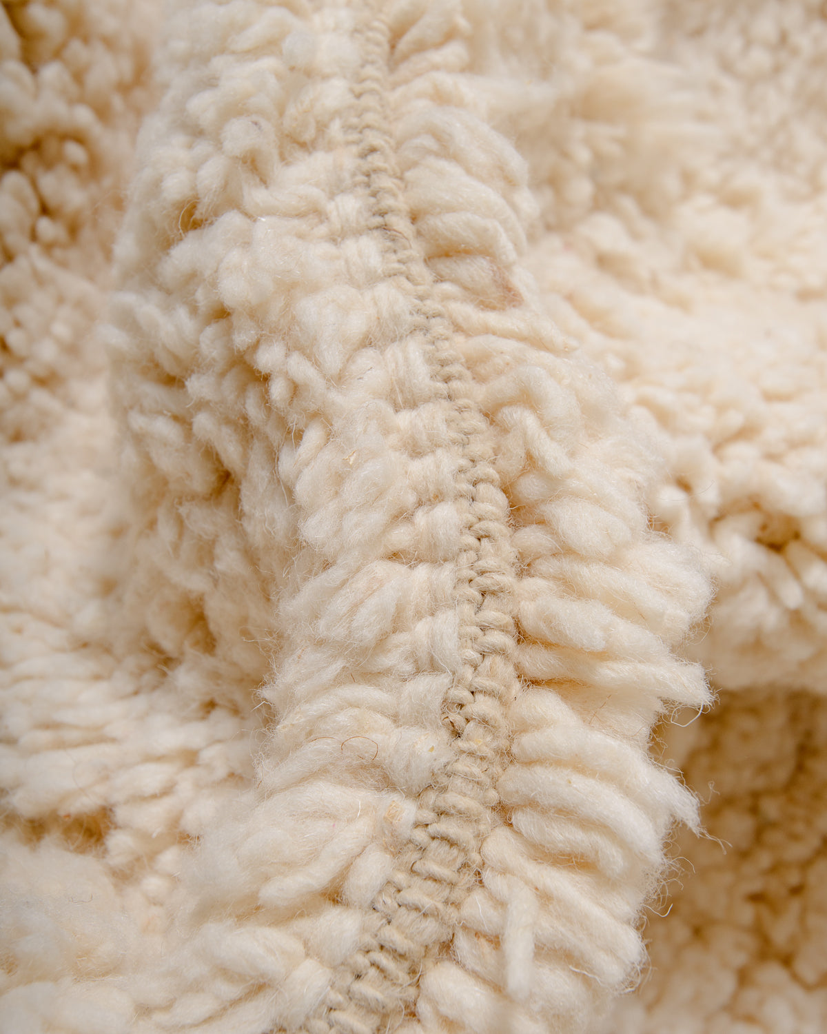 Modern, designer, handcrafted Berber rug from Morocco. Beniourain carpet with minimalist design, natural wool pile and a fluffy texture.