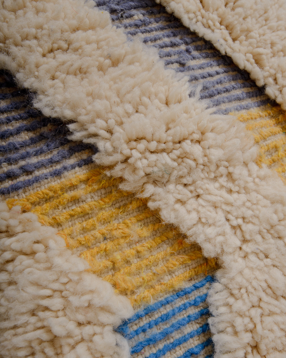 Modern, designer, handcrafted Berber rug from Morocco. Beniourain carpet with beautiful colours and patterns and fluffy wool texture.