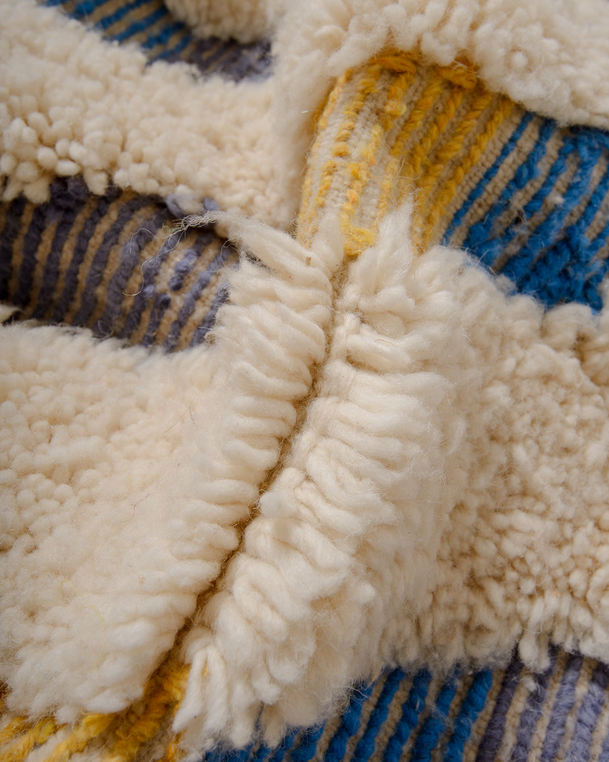 Modern, designer, handcrafted Berber rug from Morocco. Beniourain carpet with beautiful colours and patterns and fluffy wool texture.