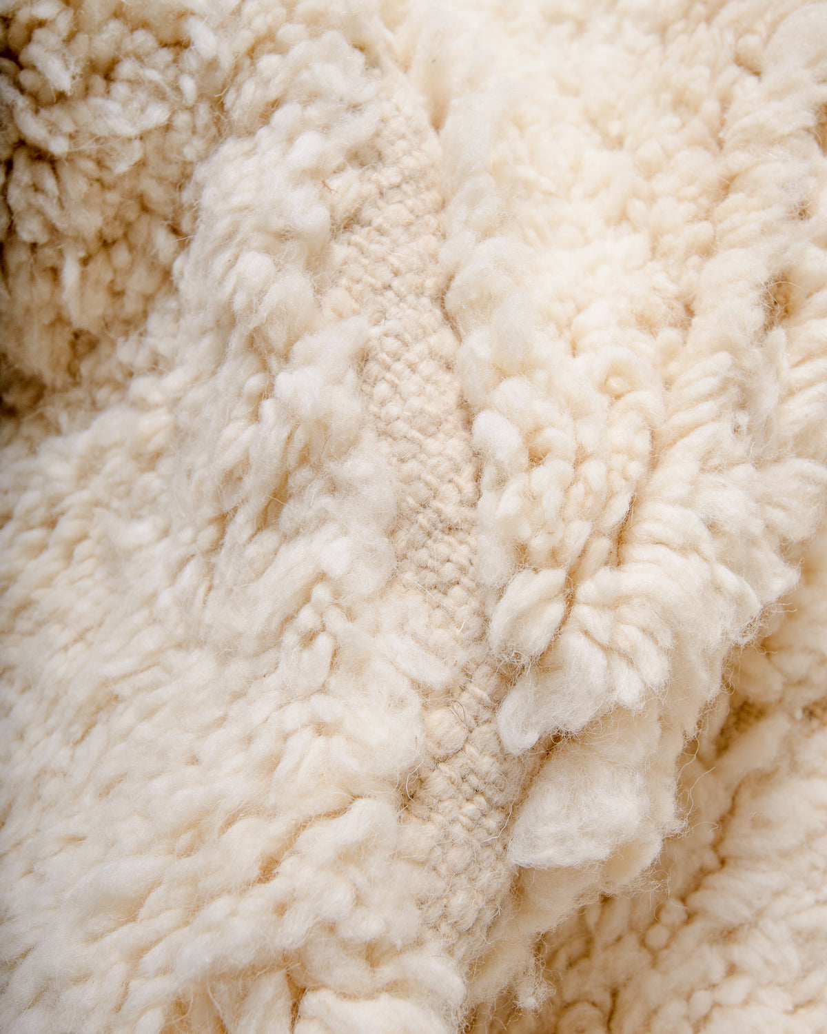 Modern, designer, handcrafted Berber rug from Morocco. Beniourain carpet with minimalist design, natural wool pile and a fluffy texture.