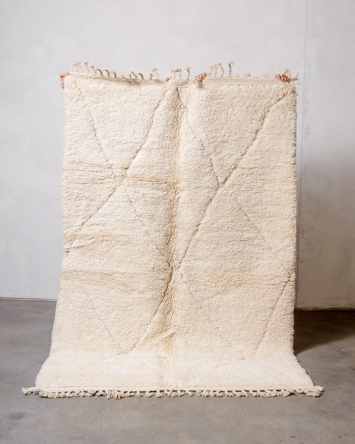 Modern, designer, handcrafted Berber rug from Morocco. Beniourain carpet with minimalist design, natural wool pile and a fluffy texture.