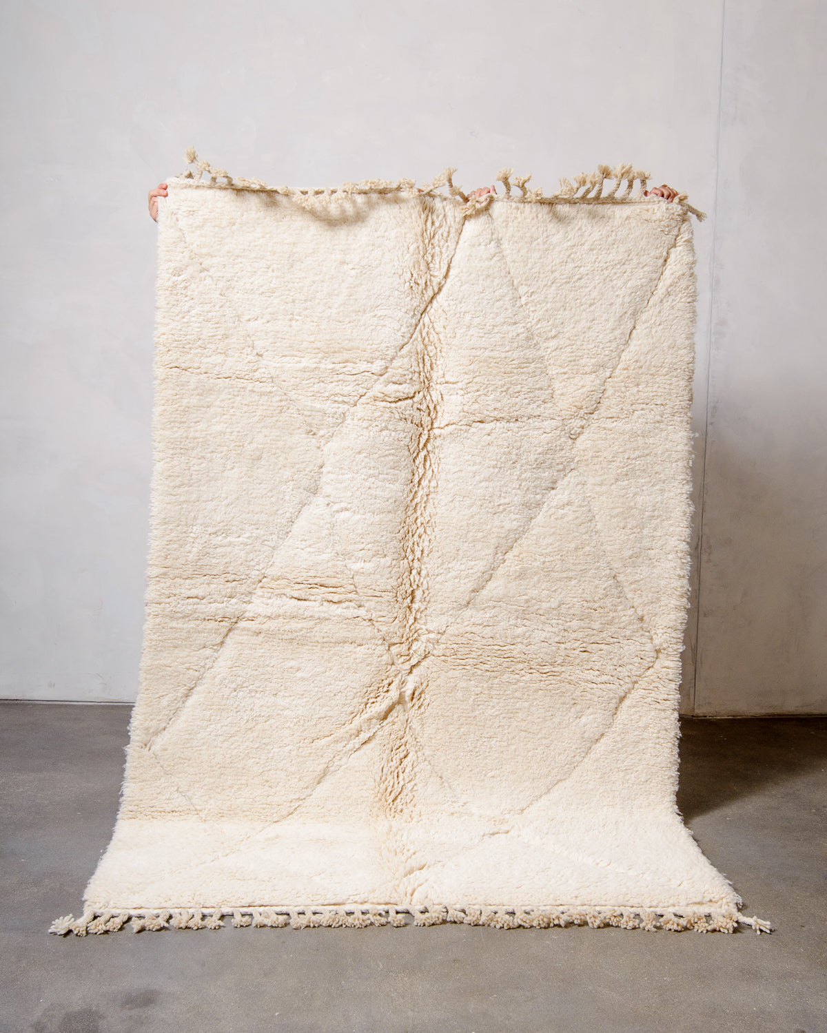 Modern, designer, handcrafted Berber rug from Morocco. Beniourain carpet with minimalist design, natural wool pile and a fluffy texture.