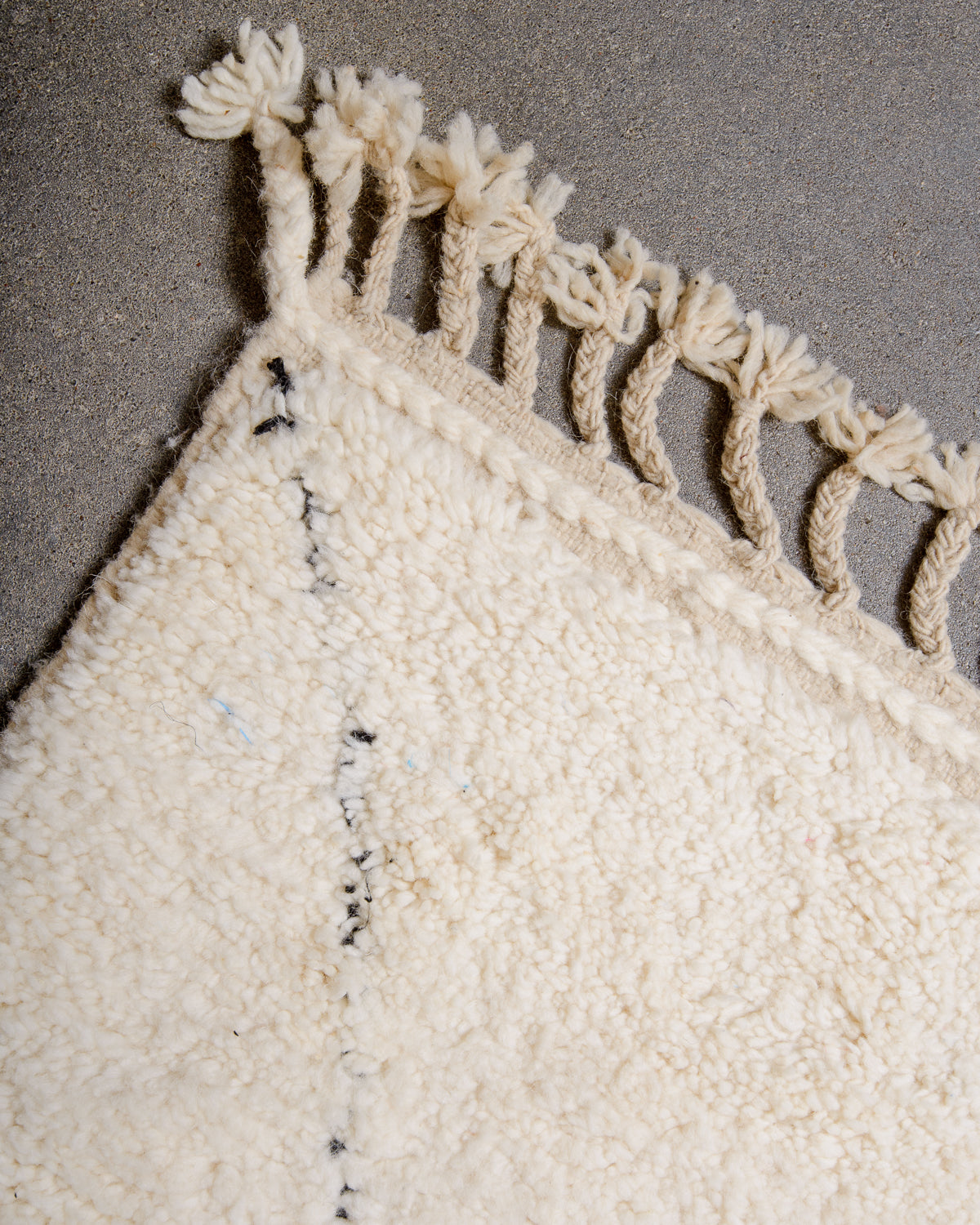 Modern, designer, handcrafted Berber rug from Morocco. Beniourain carpet with minimalist design, natural wool pile and a fluffy texture.