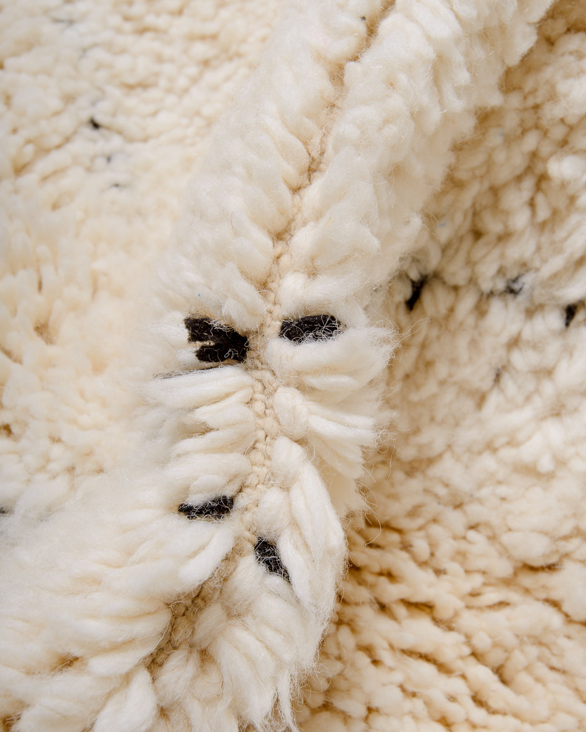 Modern, designer, handcrafted Berber rug from Morocco. Beniourain carpet with minimalist design, natural wool pile and a fluffy texture.