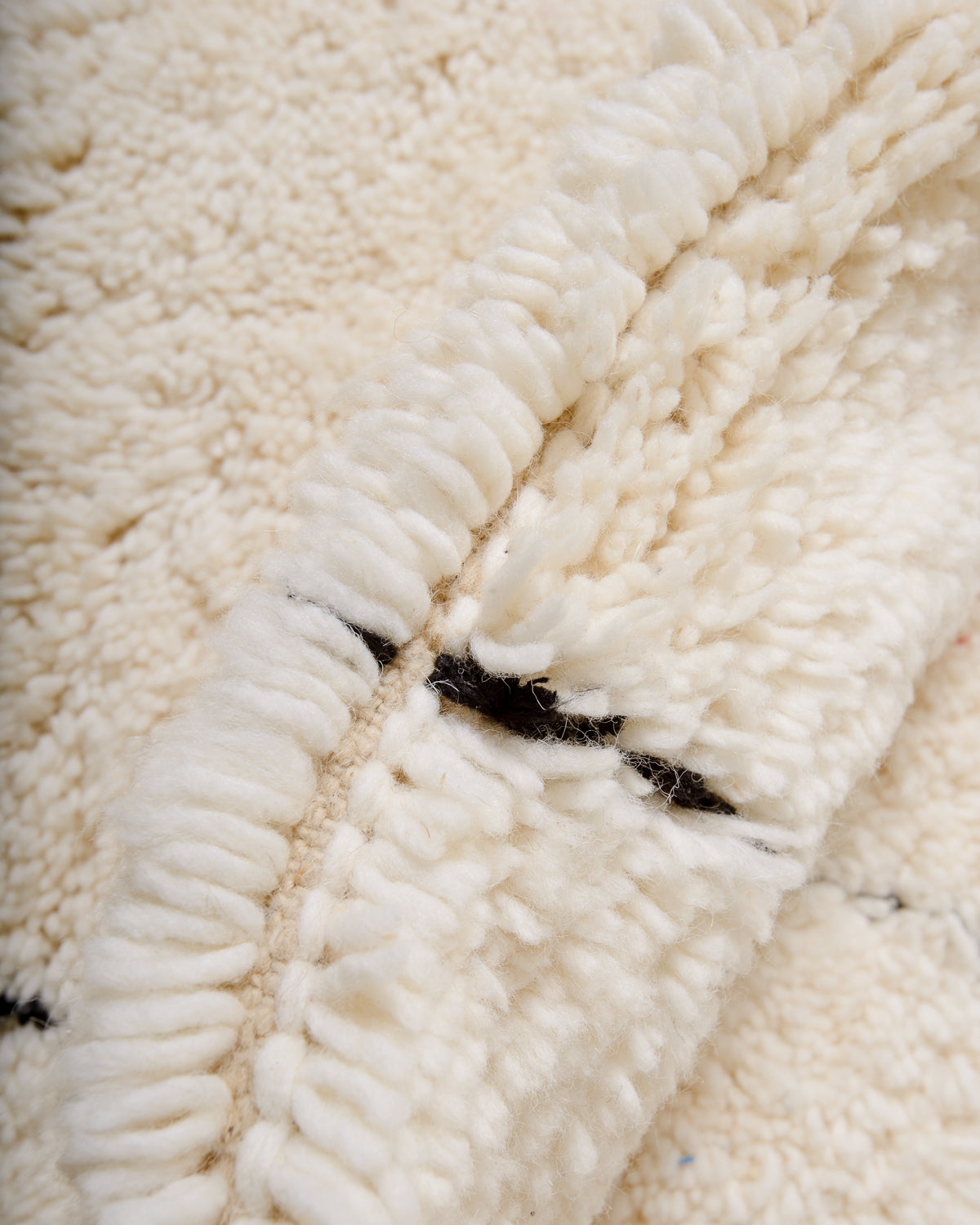 Modern, designer, handcrafted Berber rug from Morocco. Beniourain carpet with minimalist design, natural wool pile and a fluffy texture.