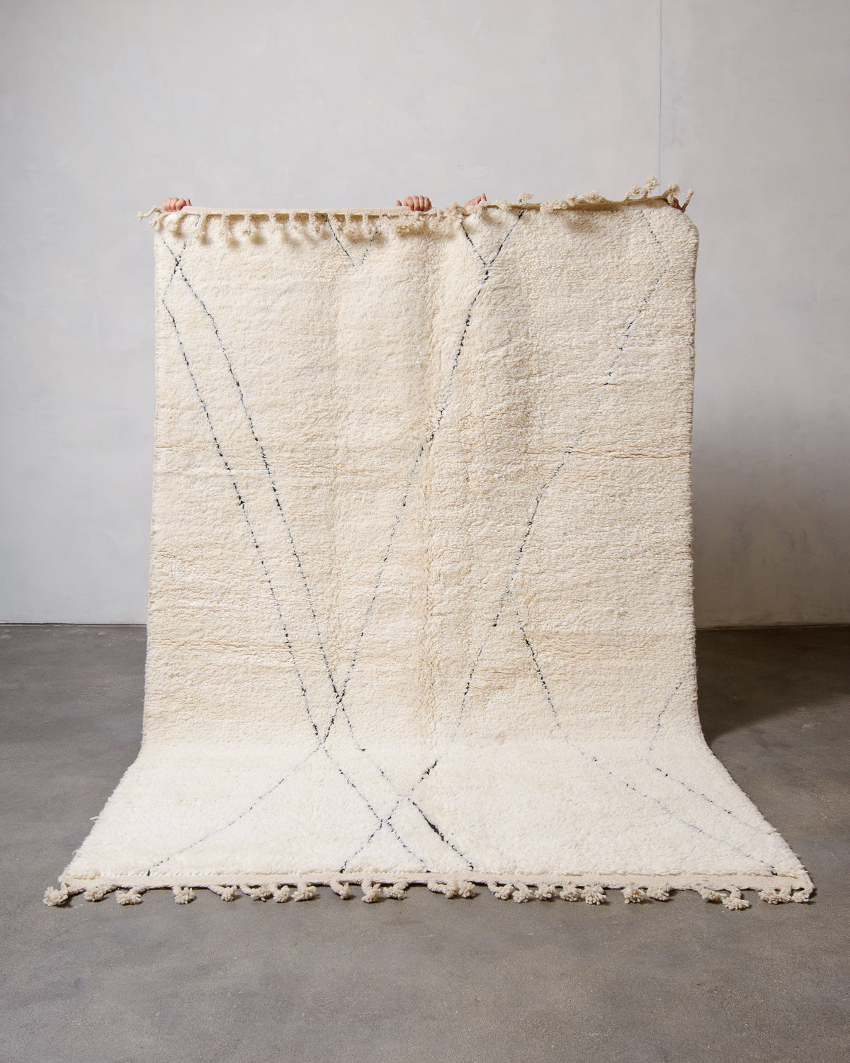 Modern, designer, handcrafted Berber rug from Morocco. Beniourain carpet with minimalist design, natural wool pile and a fluffy texture.